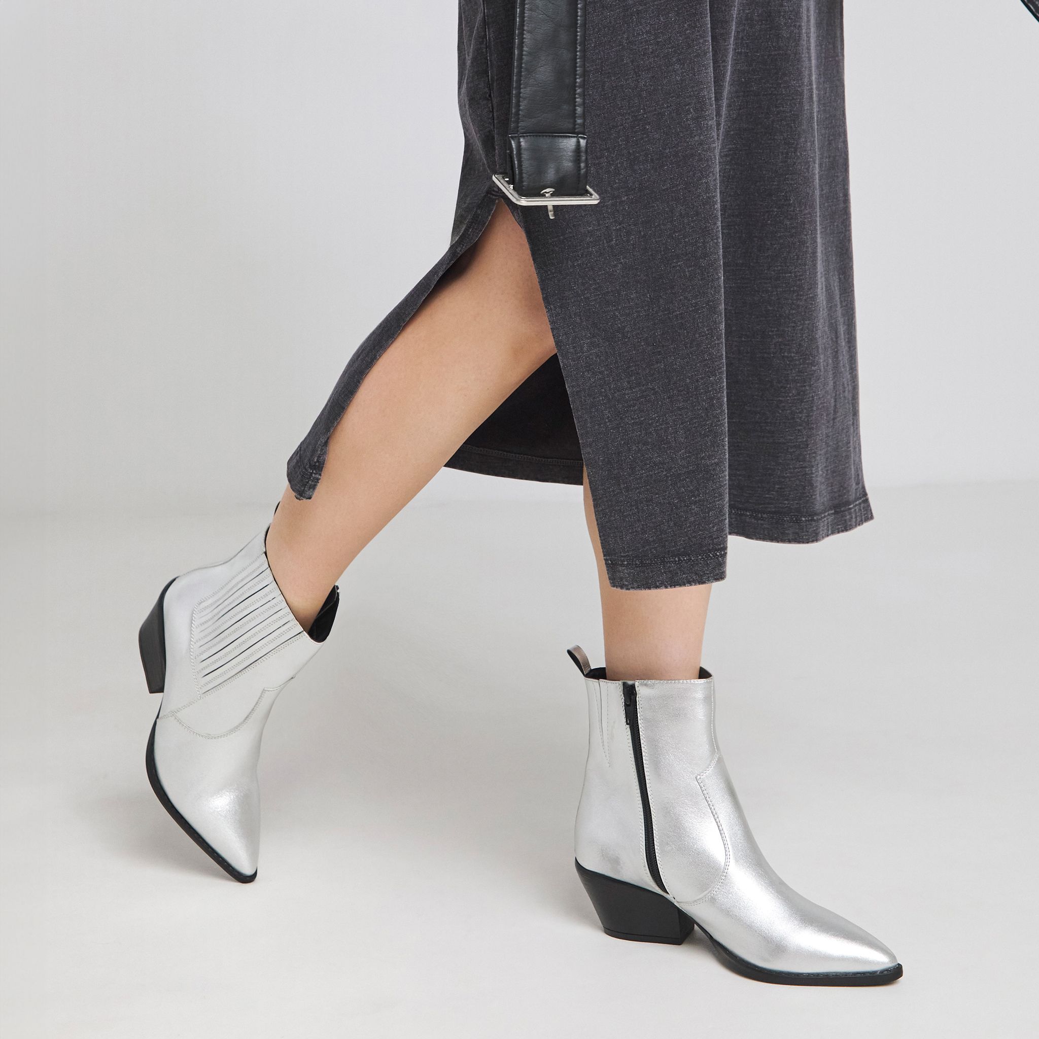 Denim skirt with silver cowboy boots