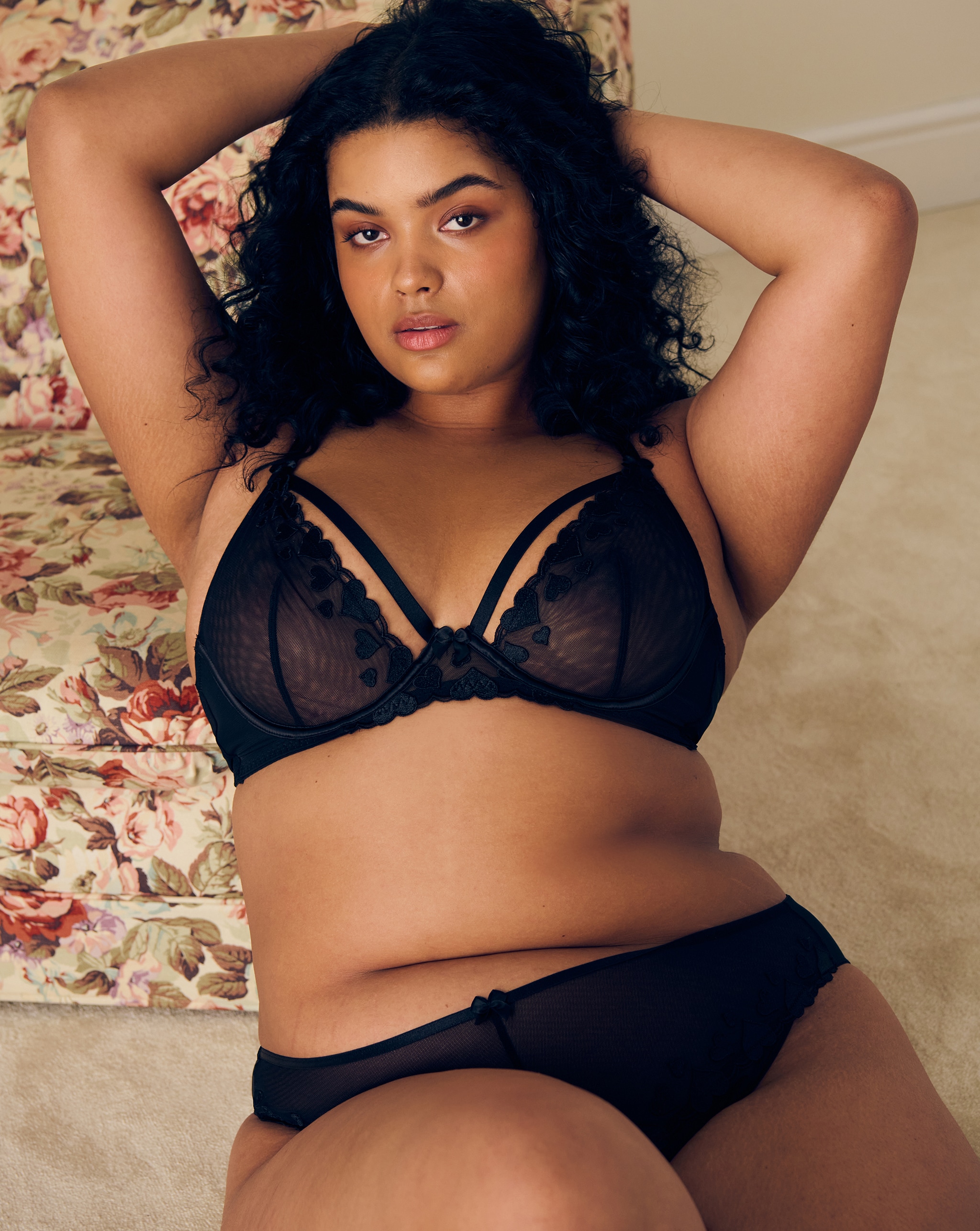 Model wears black lingerie set