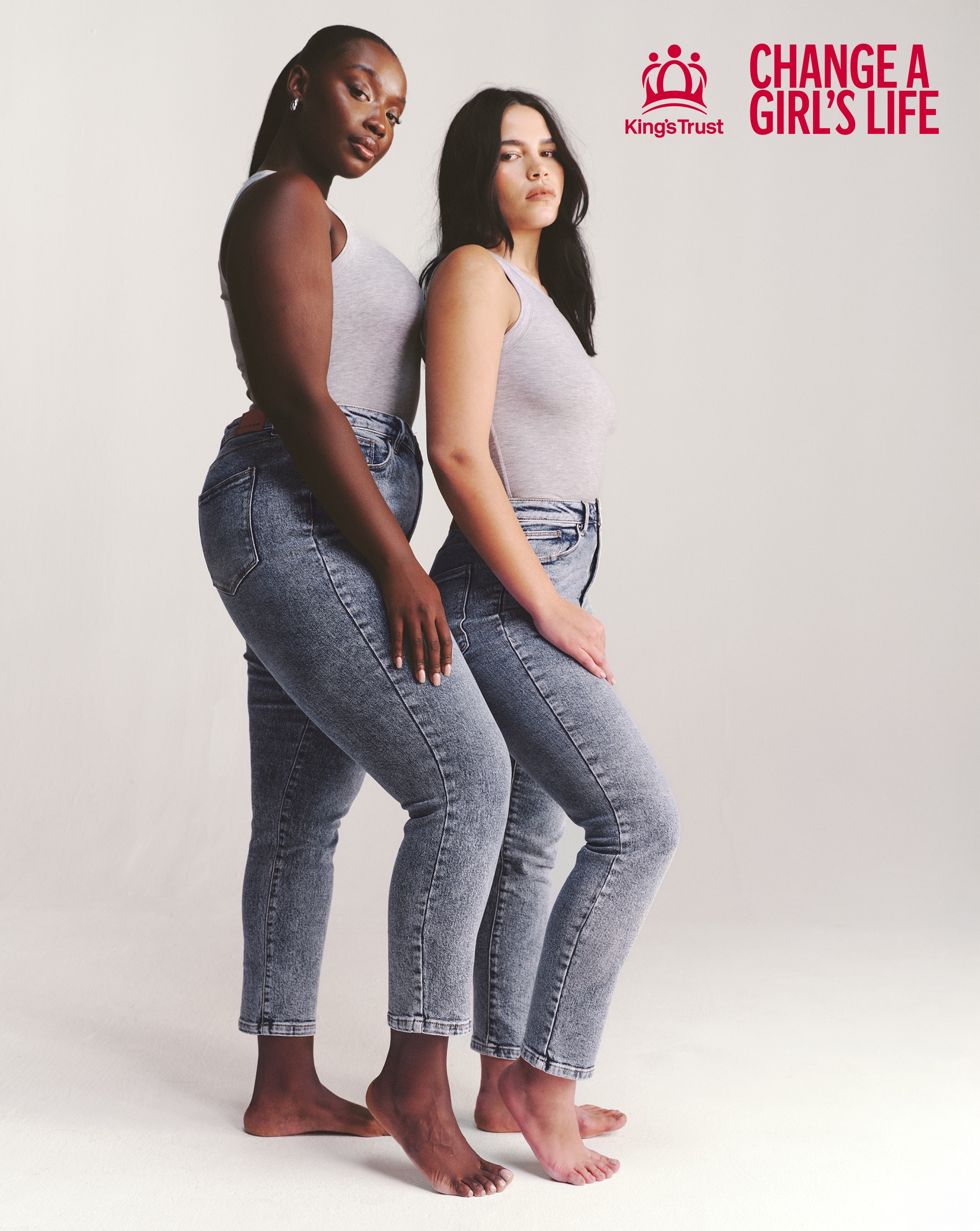 Two models wearing the slim mon jeans in mid-blue