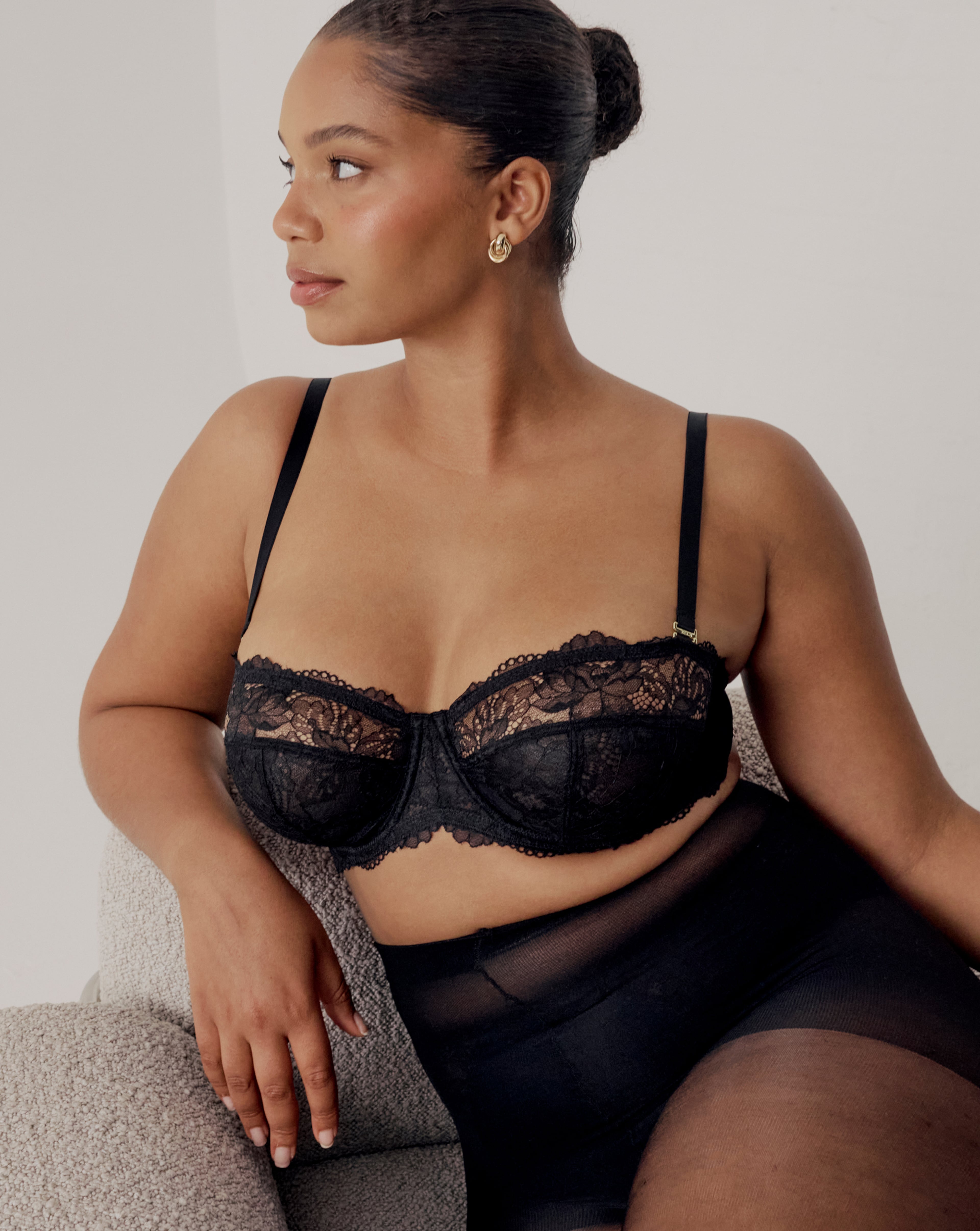 Model wears lingerie set in black with lace detail
