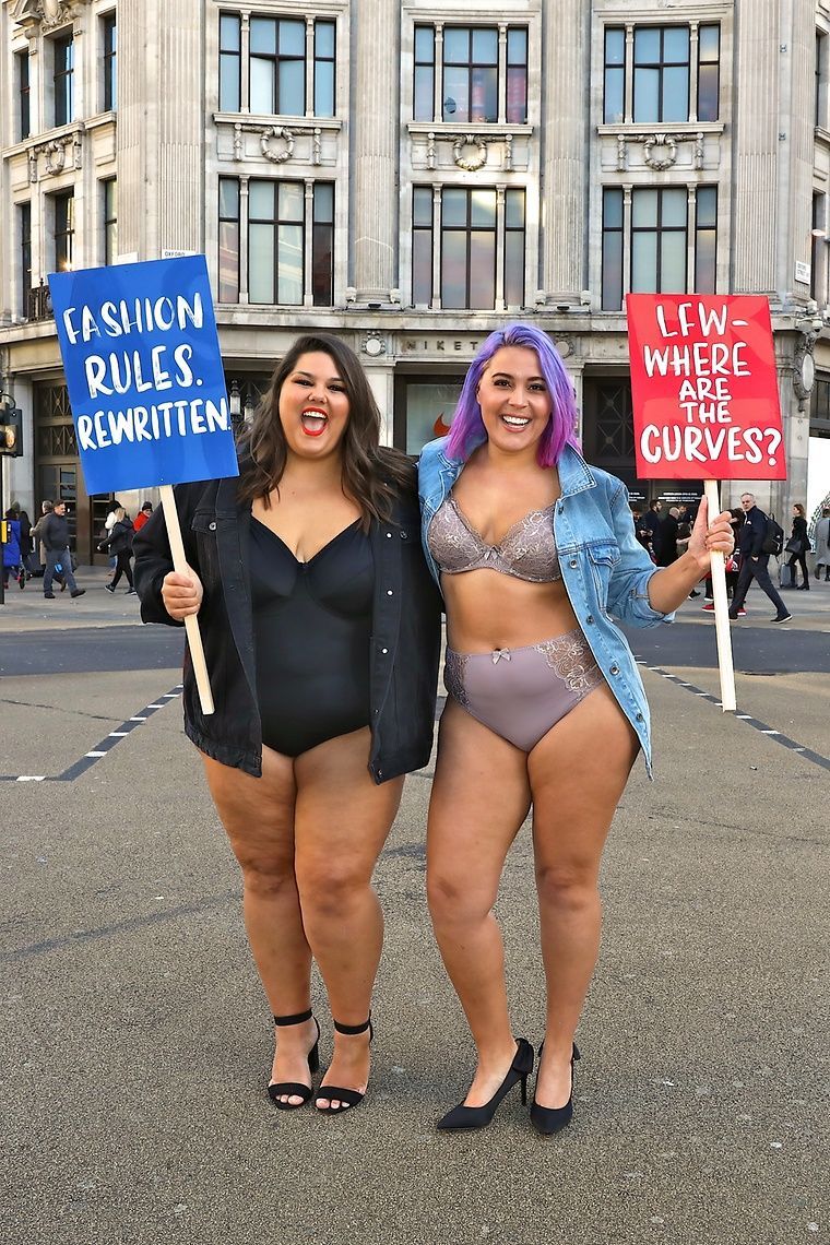 Megan Crabbe and Callie Thorpe with placards