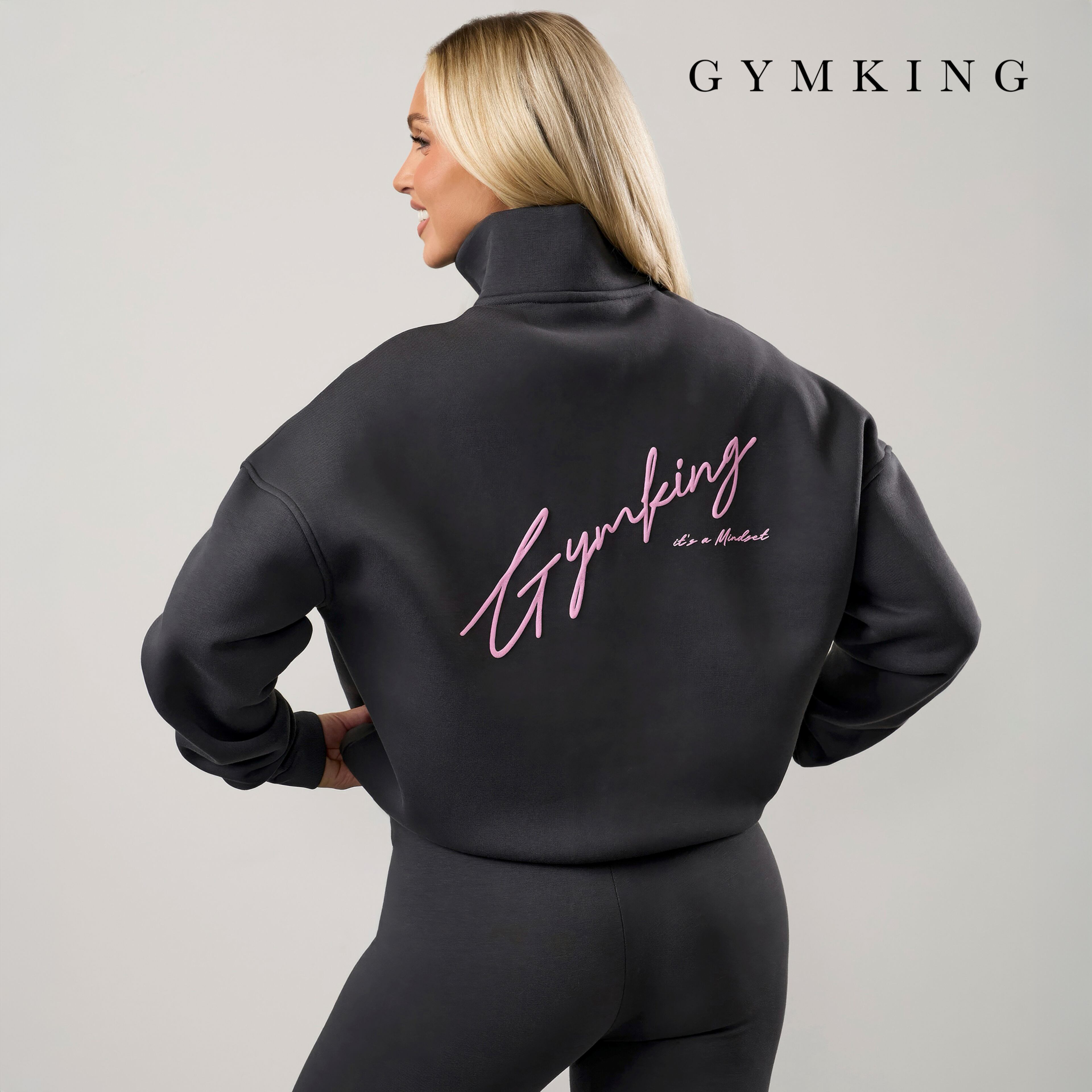 Model wears quarter zip top from Gym King