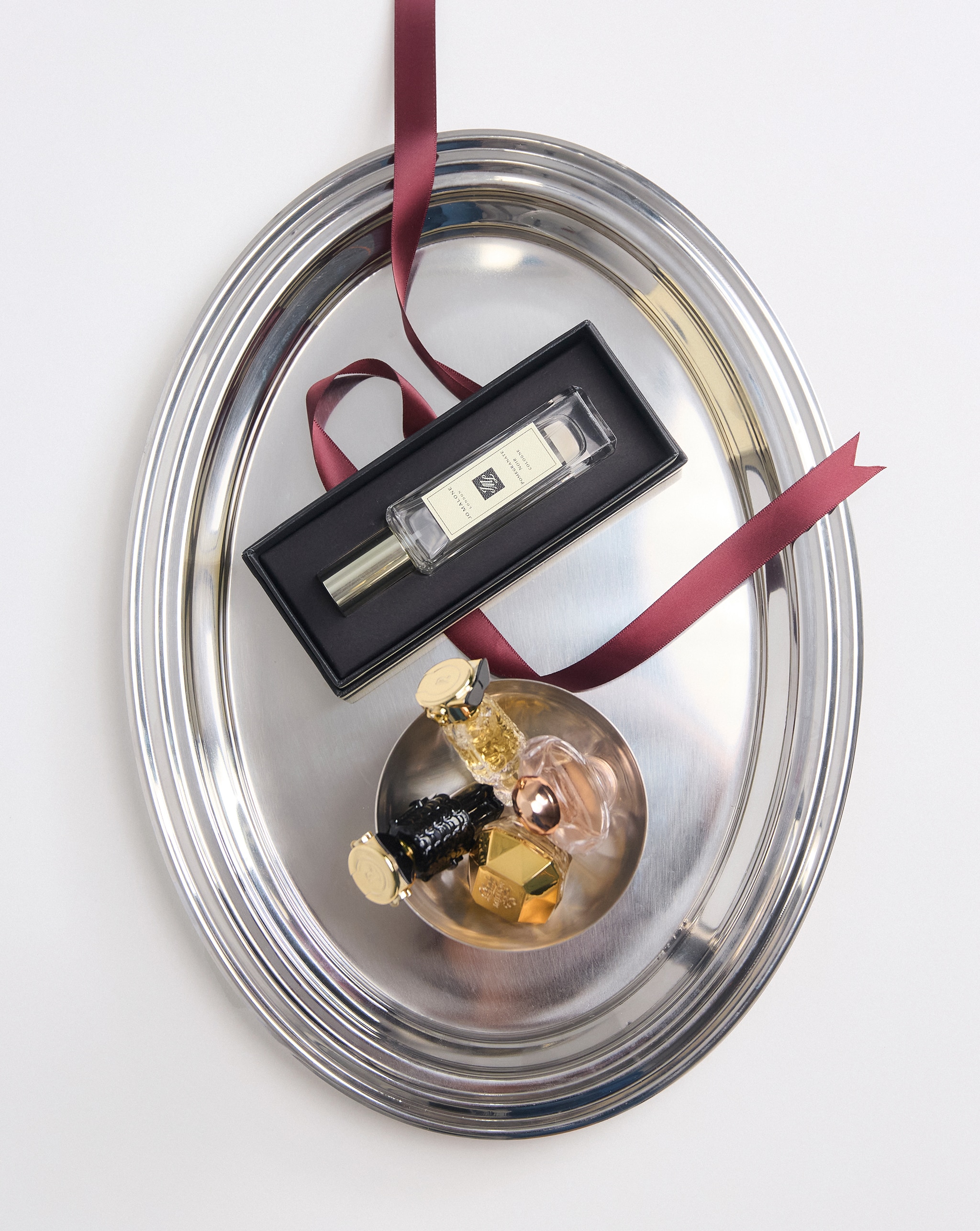 Fragrance bottles on silver tray