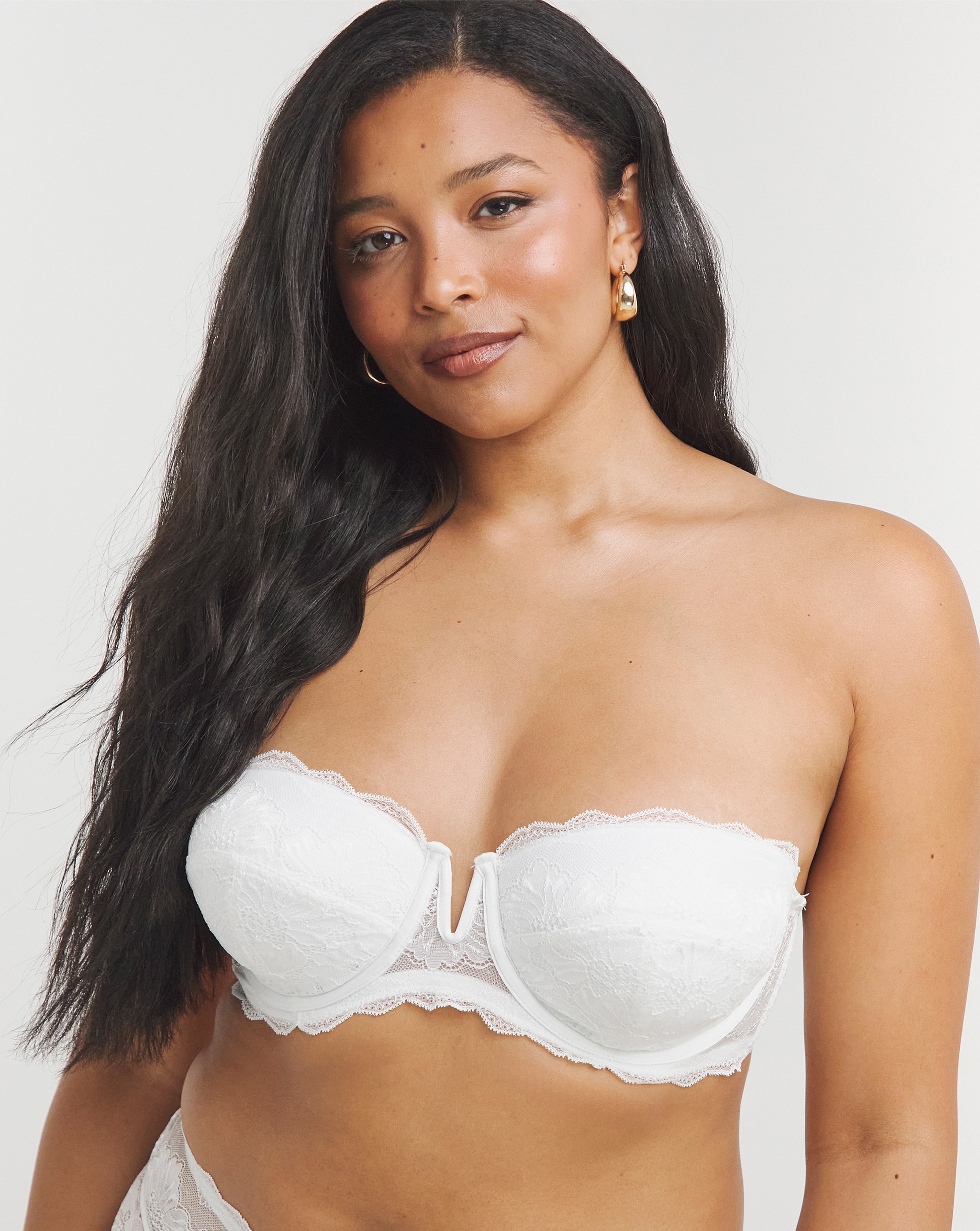 Model wearing a white strapless bra