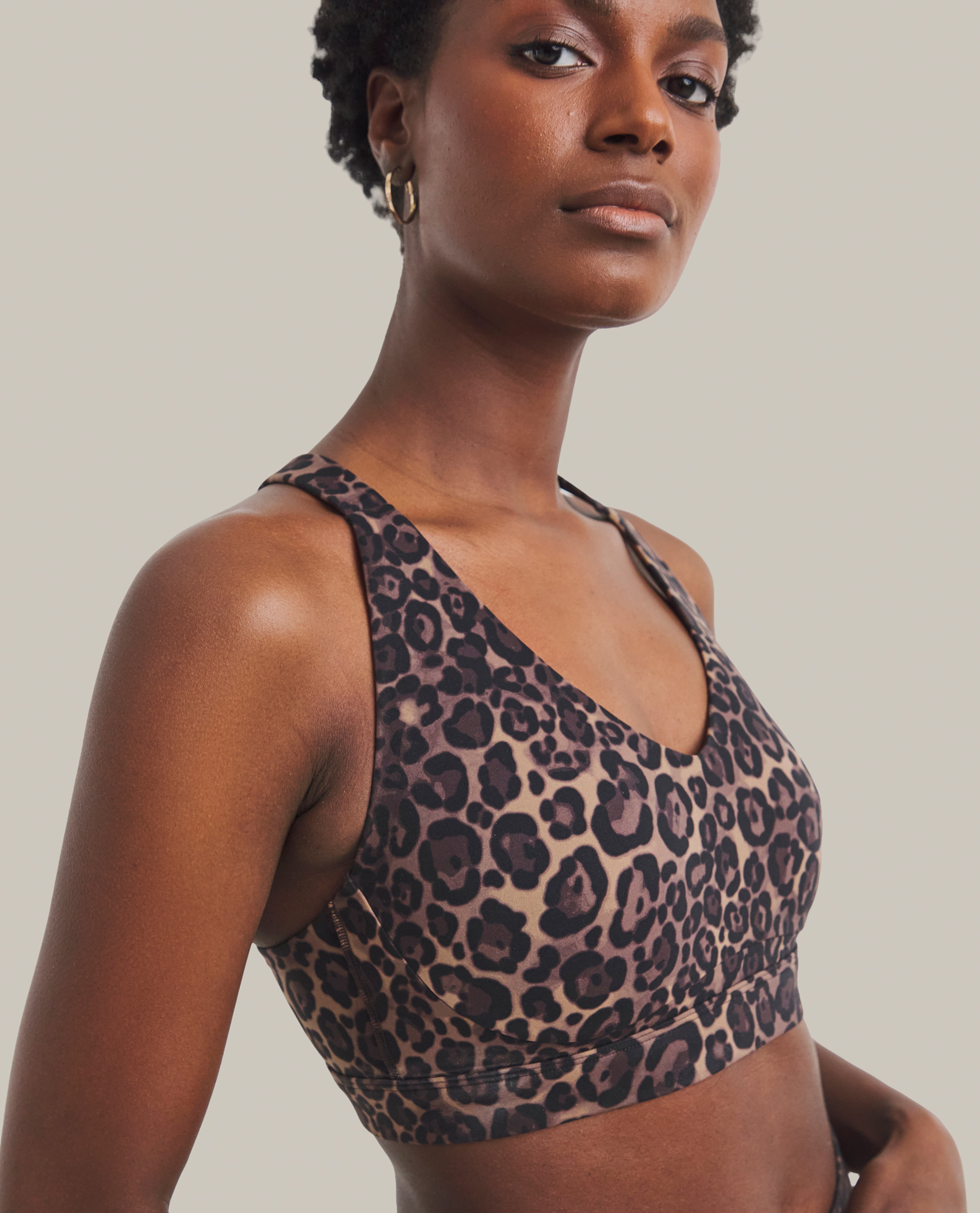 Model wears sports bra in leopard print