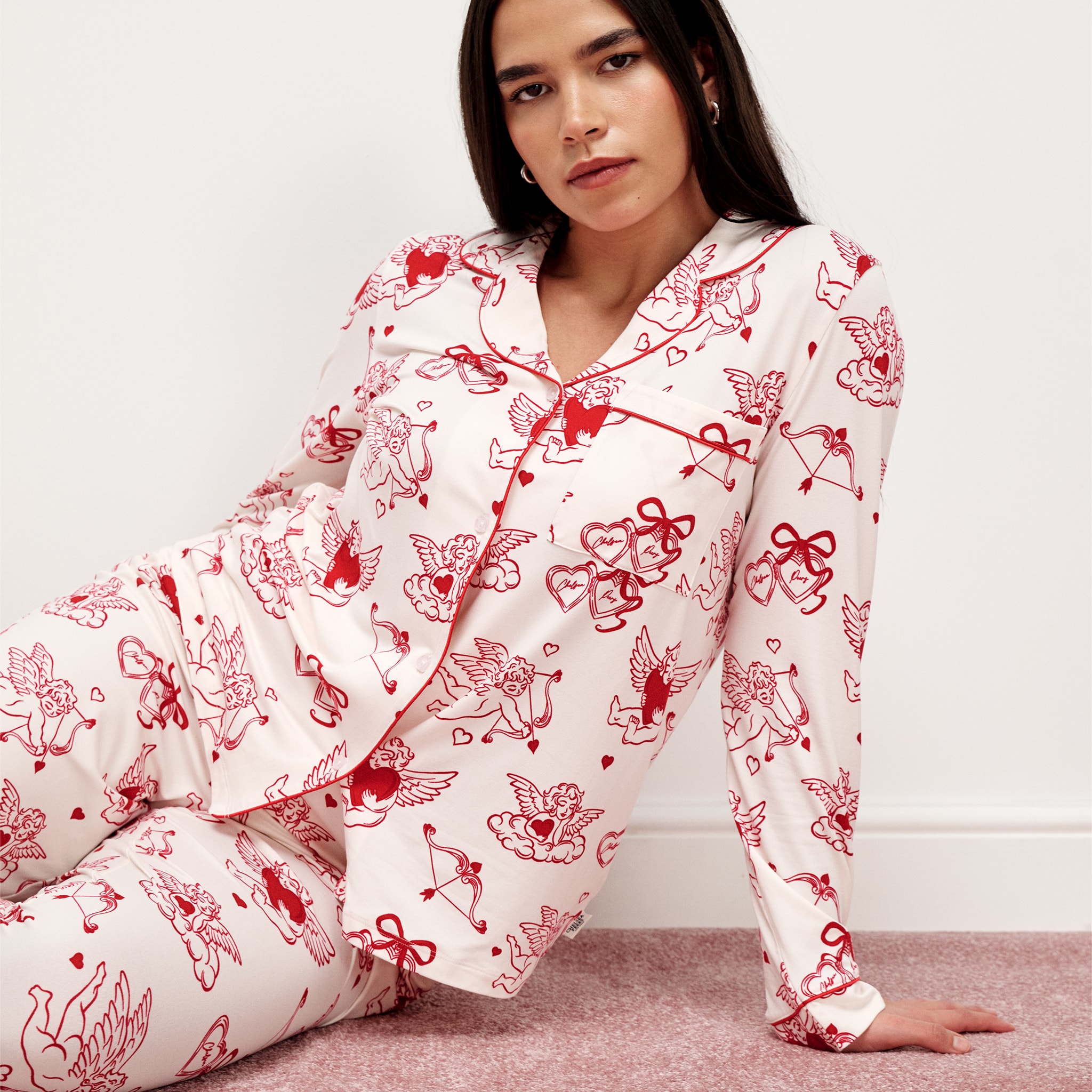 Model wears white and red pyjama set