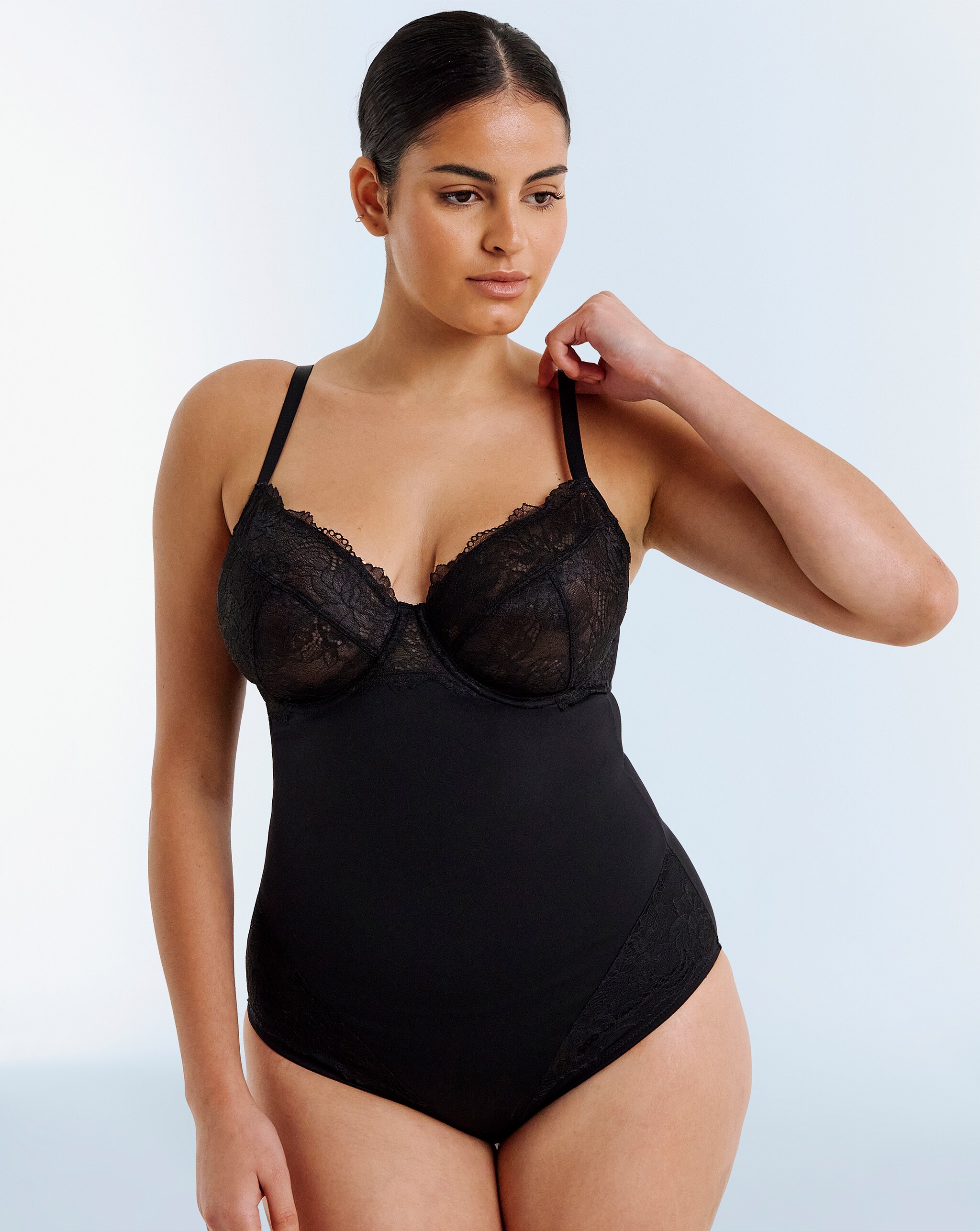 Model wears shapewear body in black