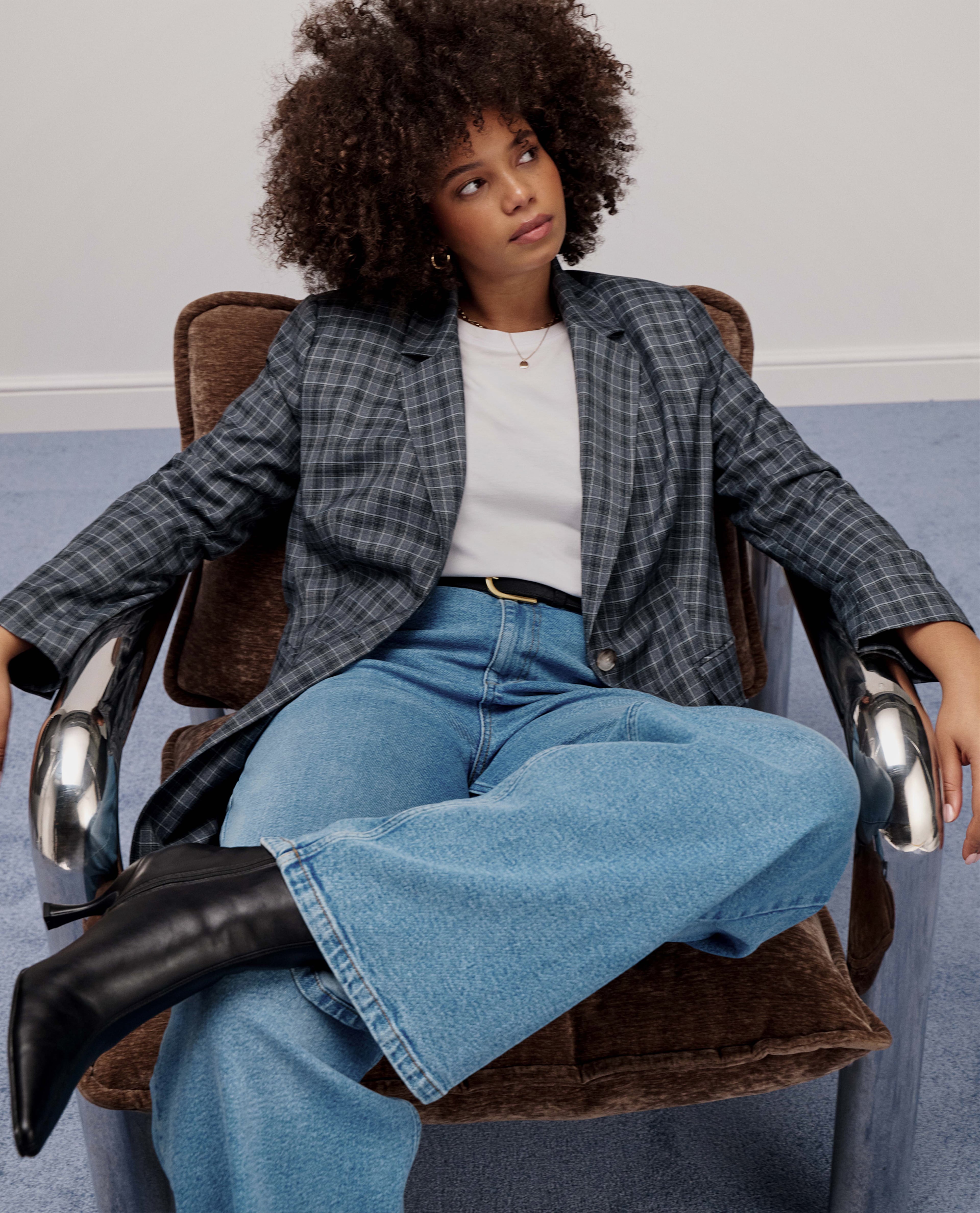Model wears new season jacket, tee and jeans