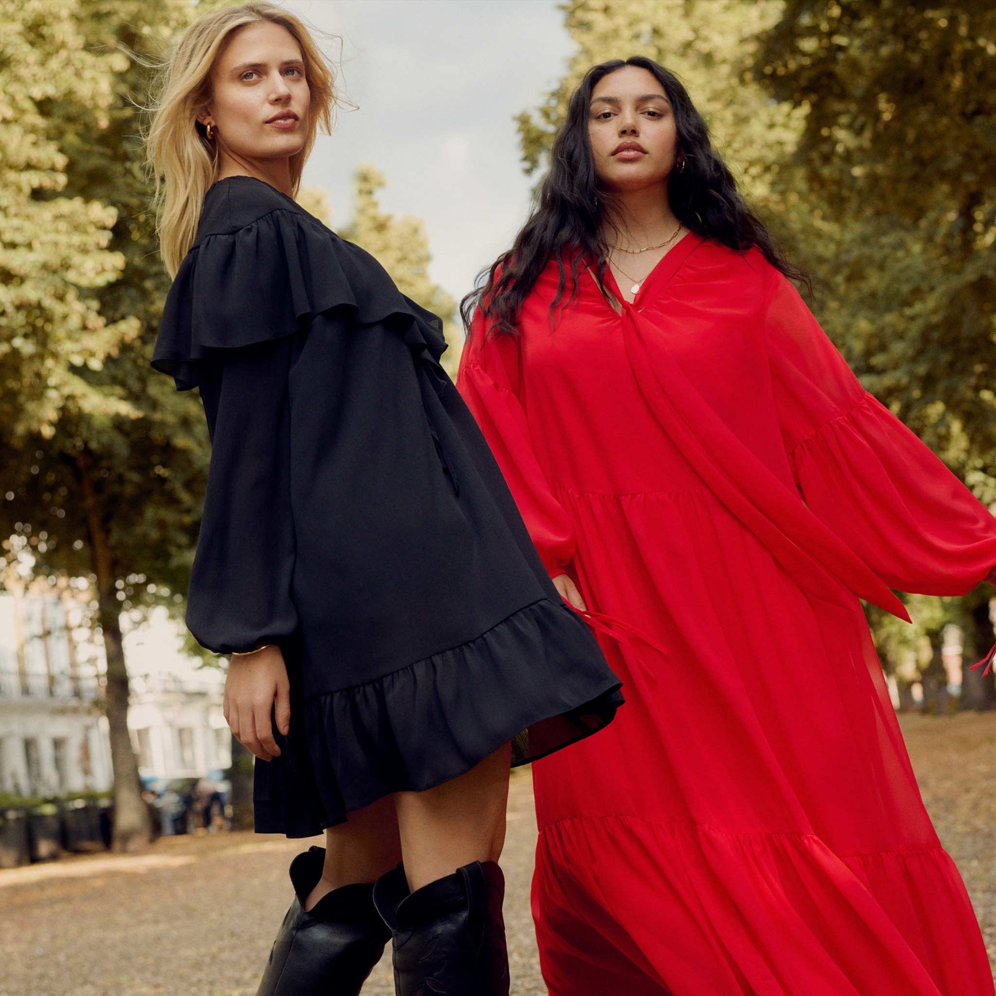 Two women wear dresses