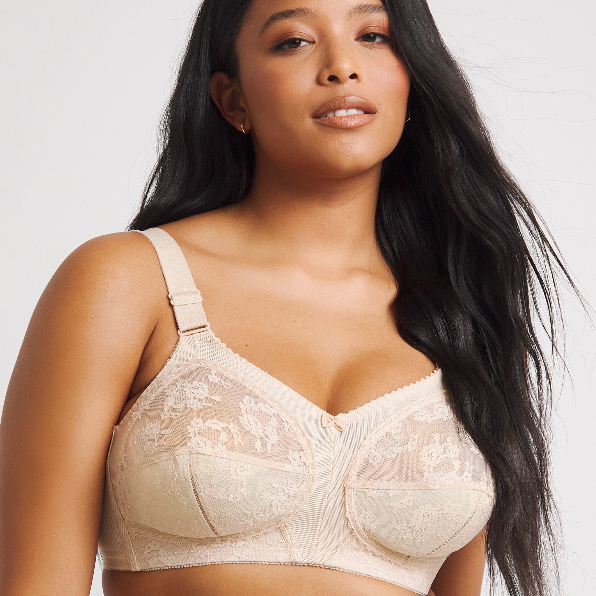 Model wears wireless bra in off-white