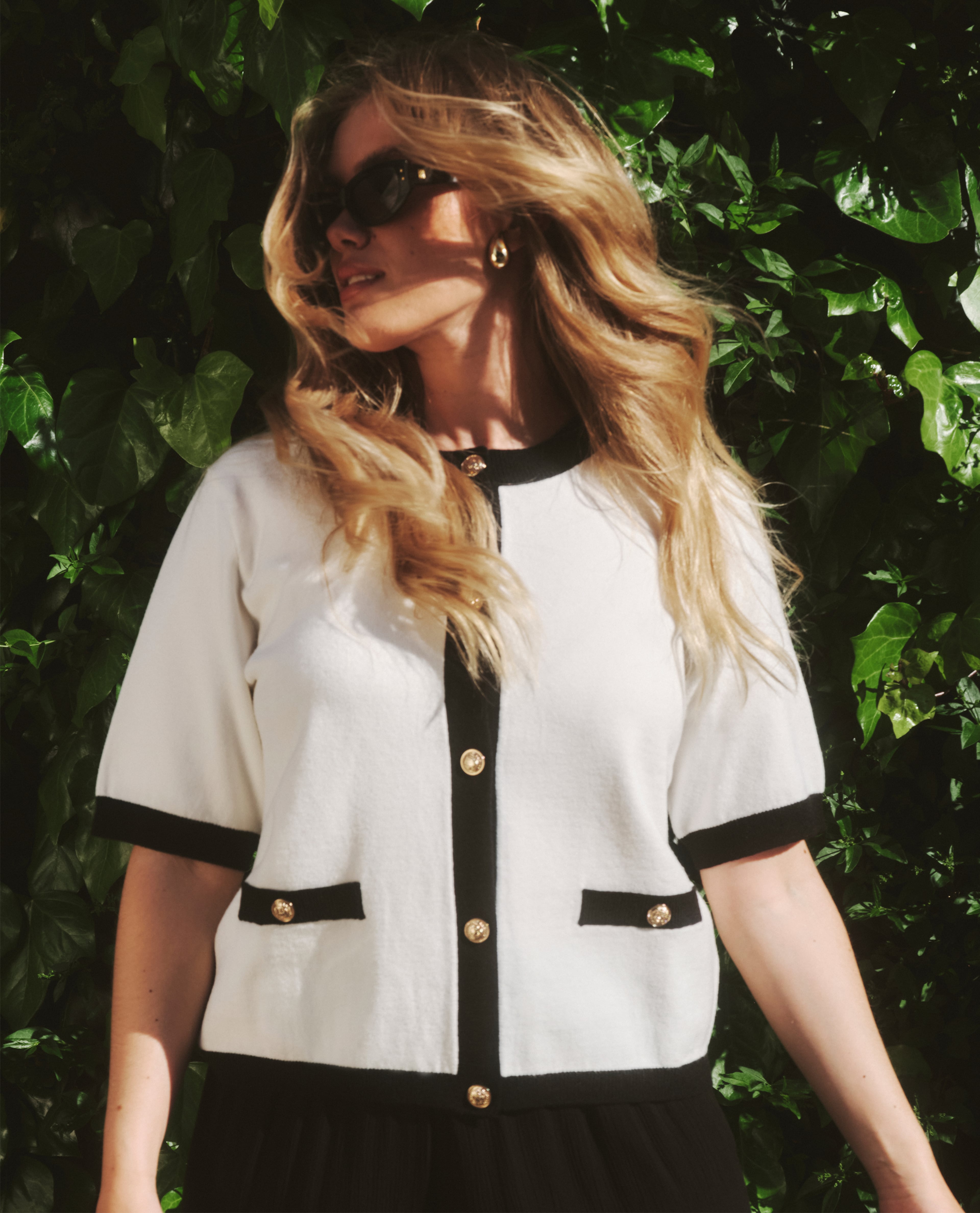 Model wears summer cardigan from the basics range