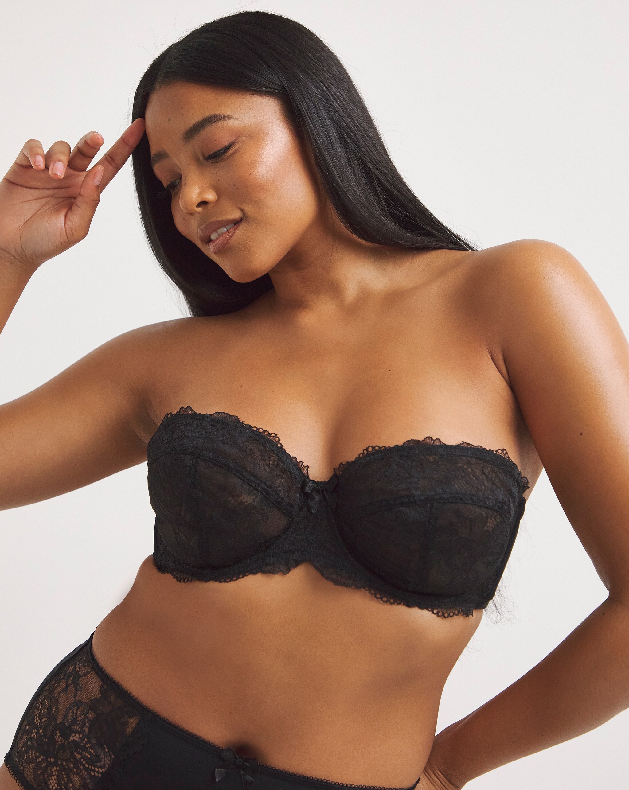 Model wearing a black strapless bra