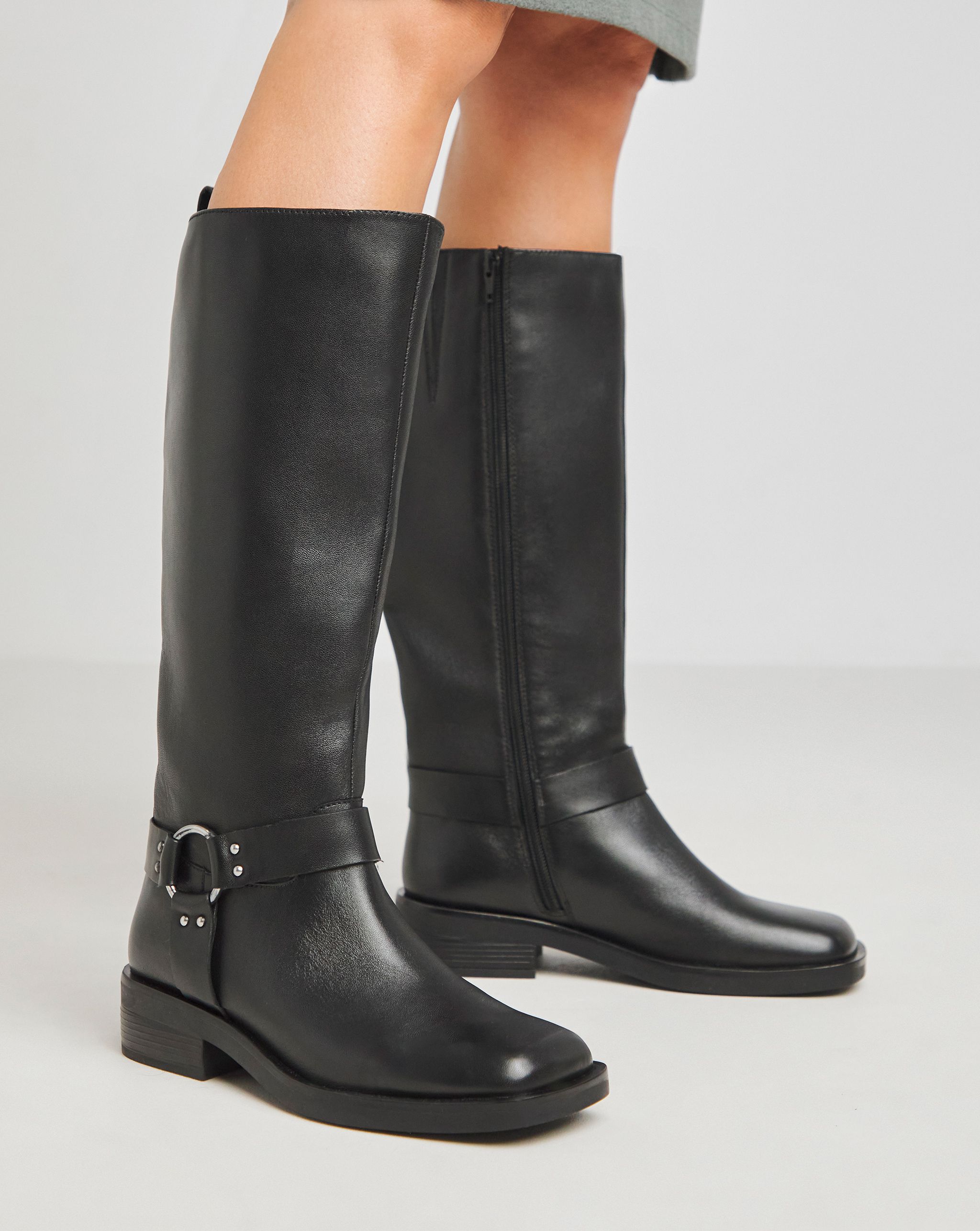 A pair of black biker boots