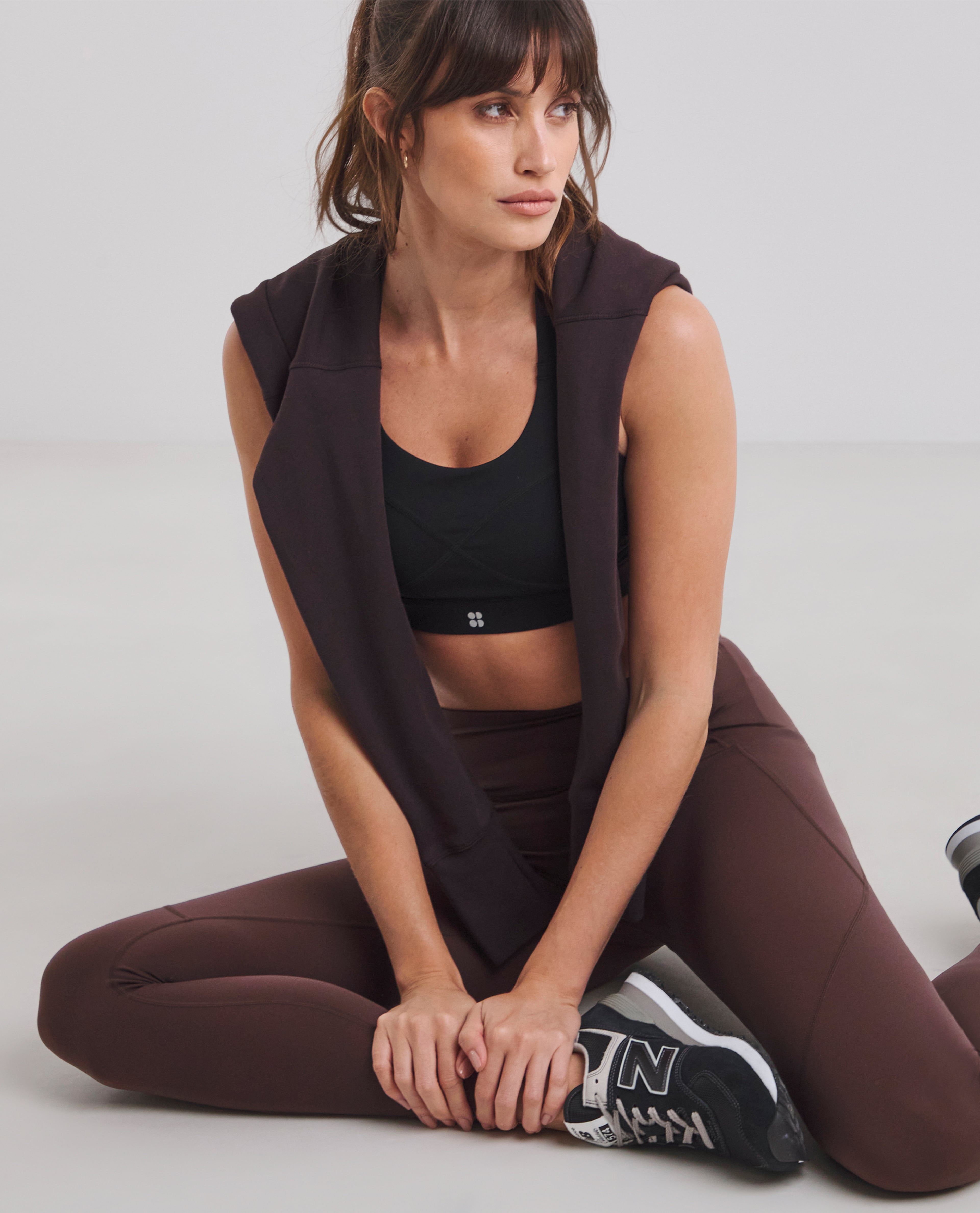 Model wears sportswear from Sweaty Betty