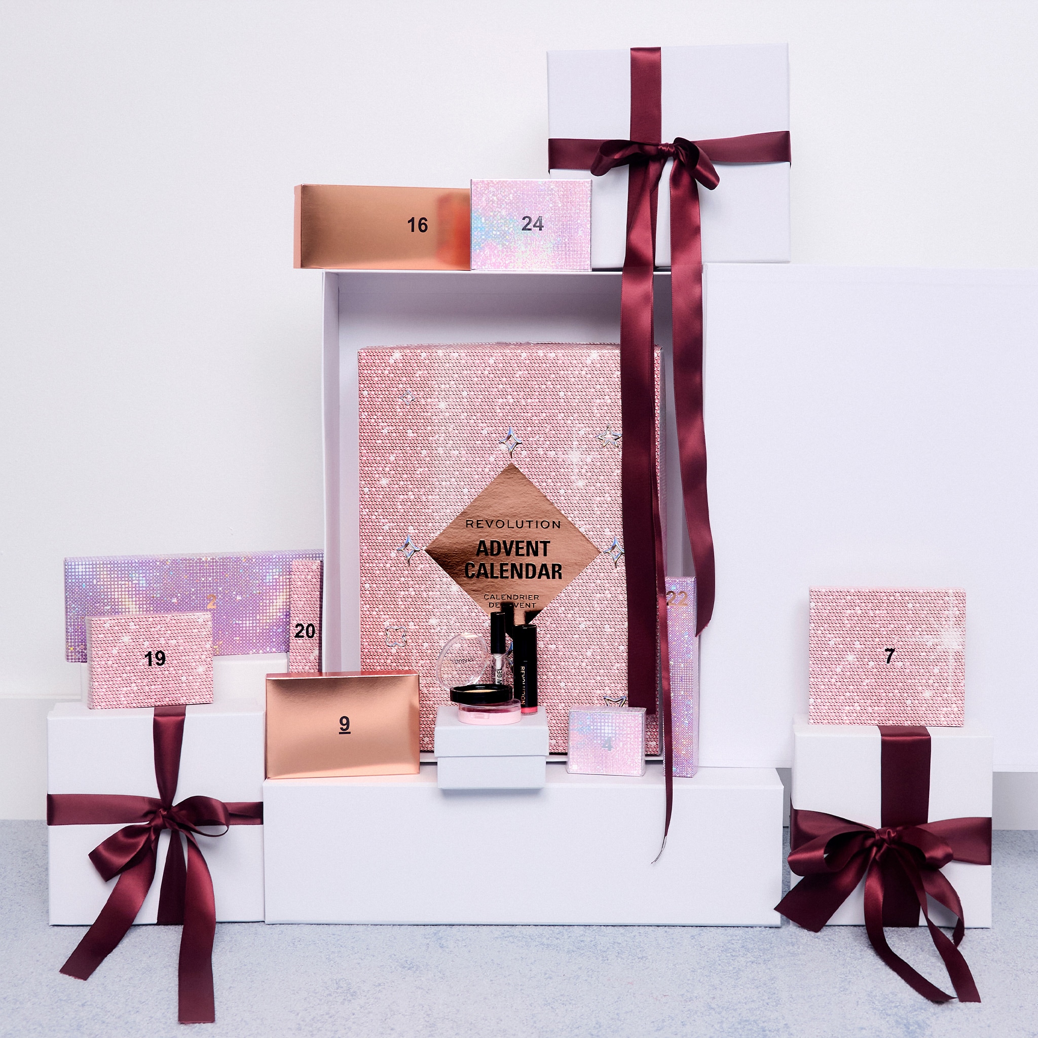 Advent calendar boxes stacked up with red bows