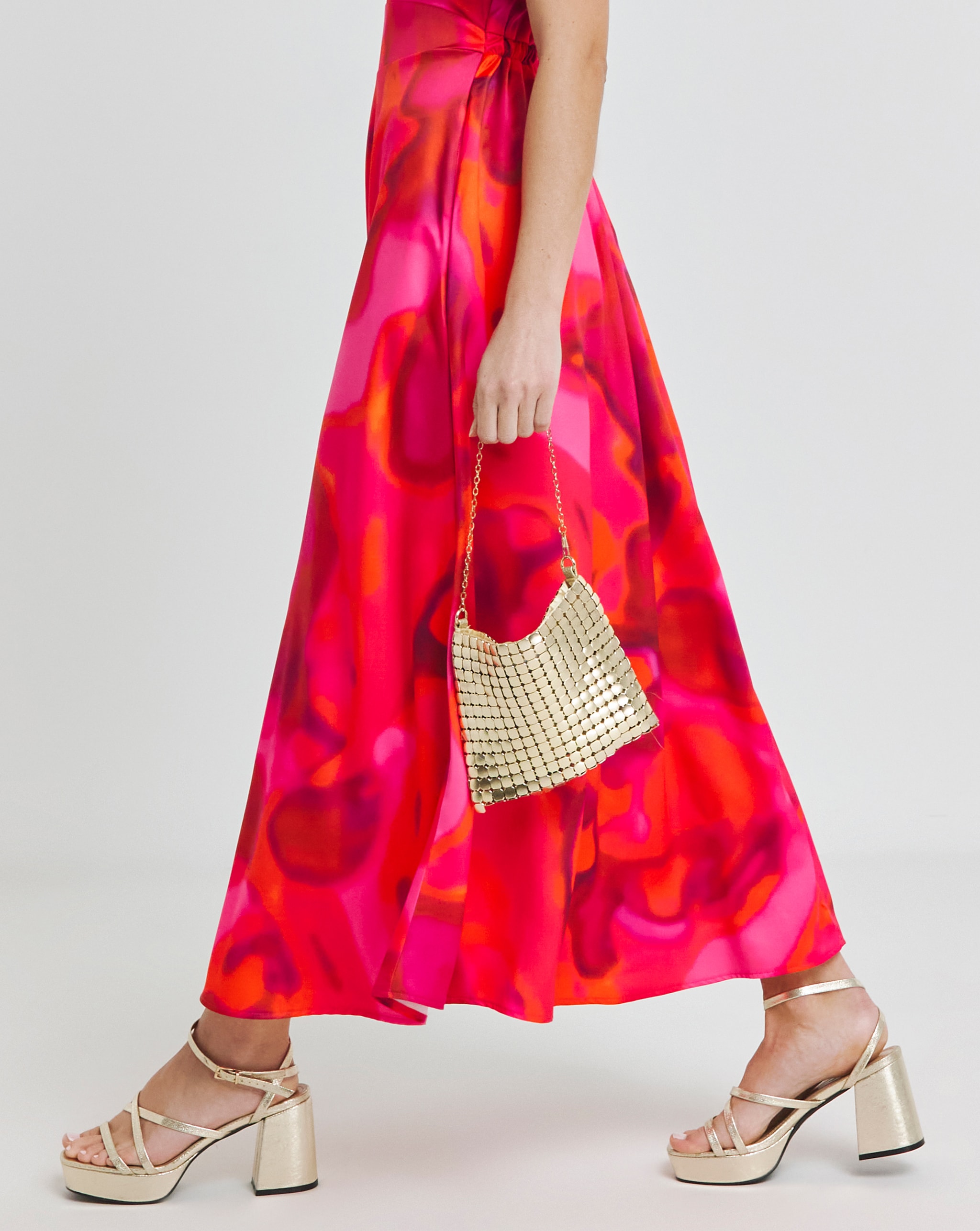 Matching gold bag and strappy heels