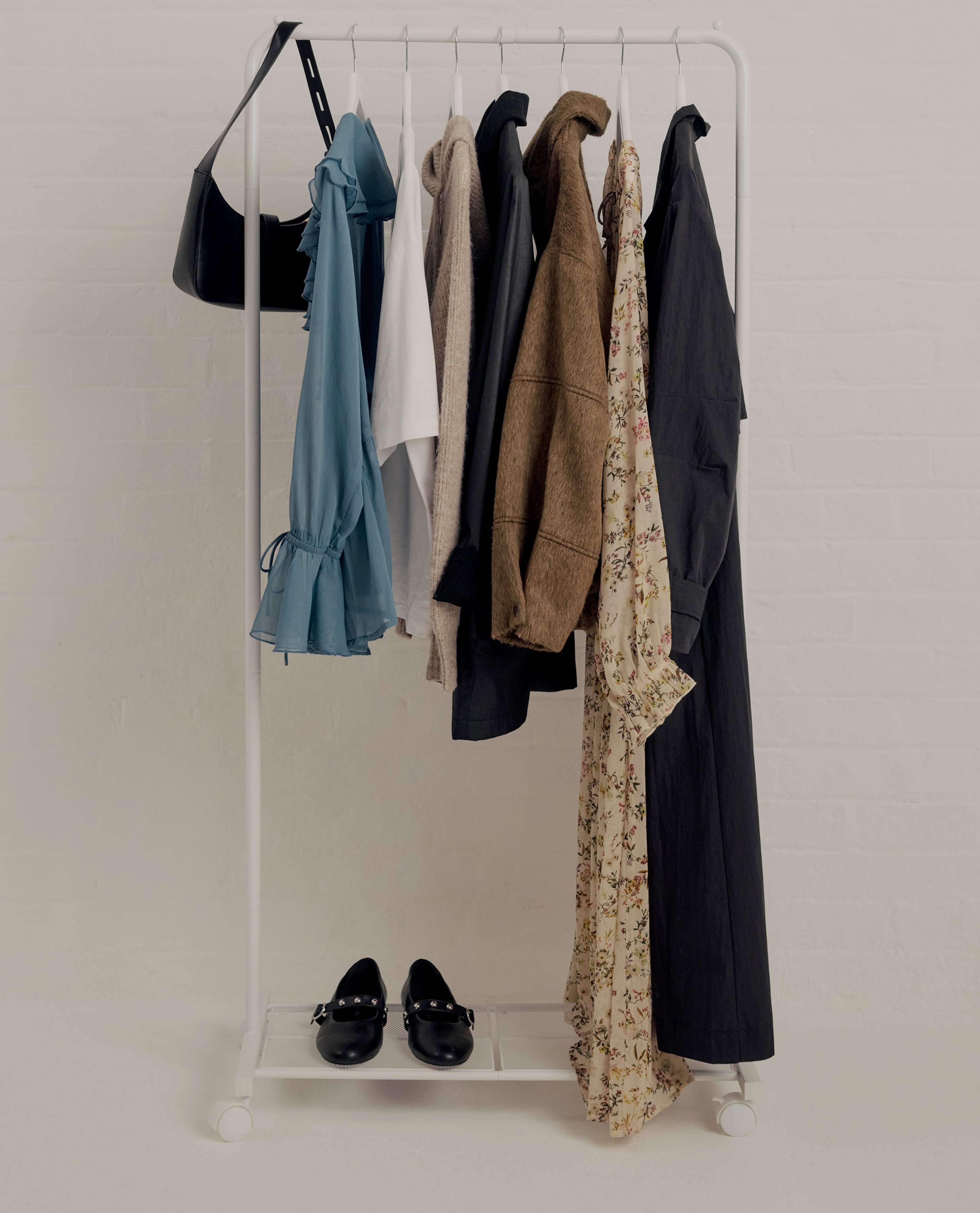Simply Be New Season clothing, shoes and accessories on a rail displayed