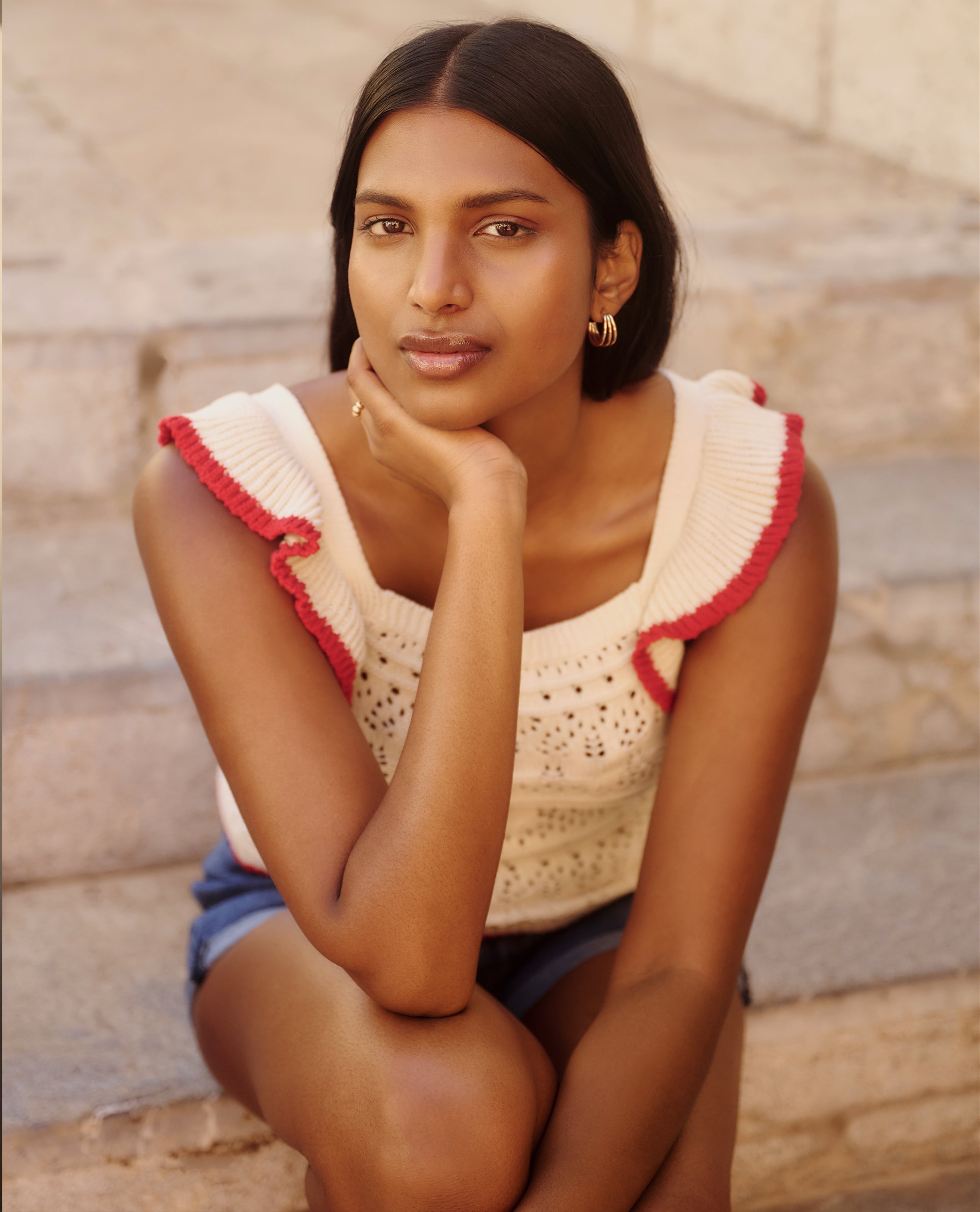 Model wears crochet summer knit in white
