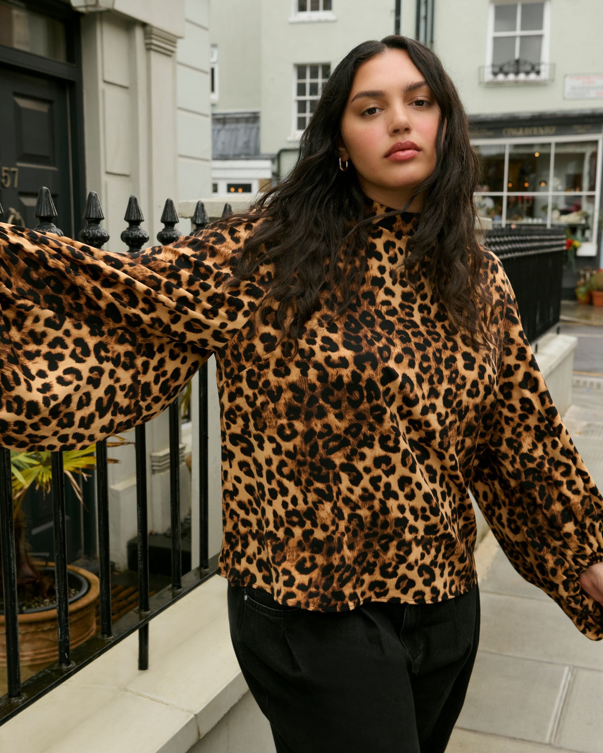 woman wearing leopard print top