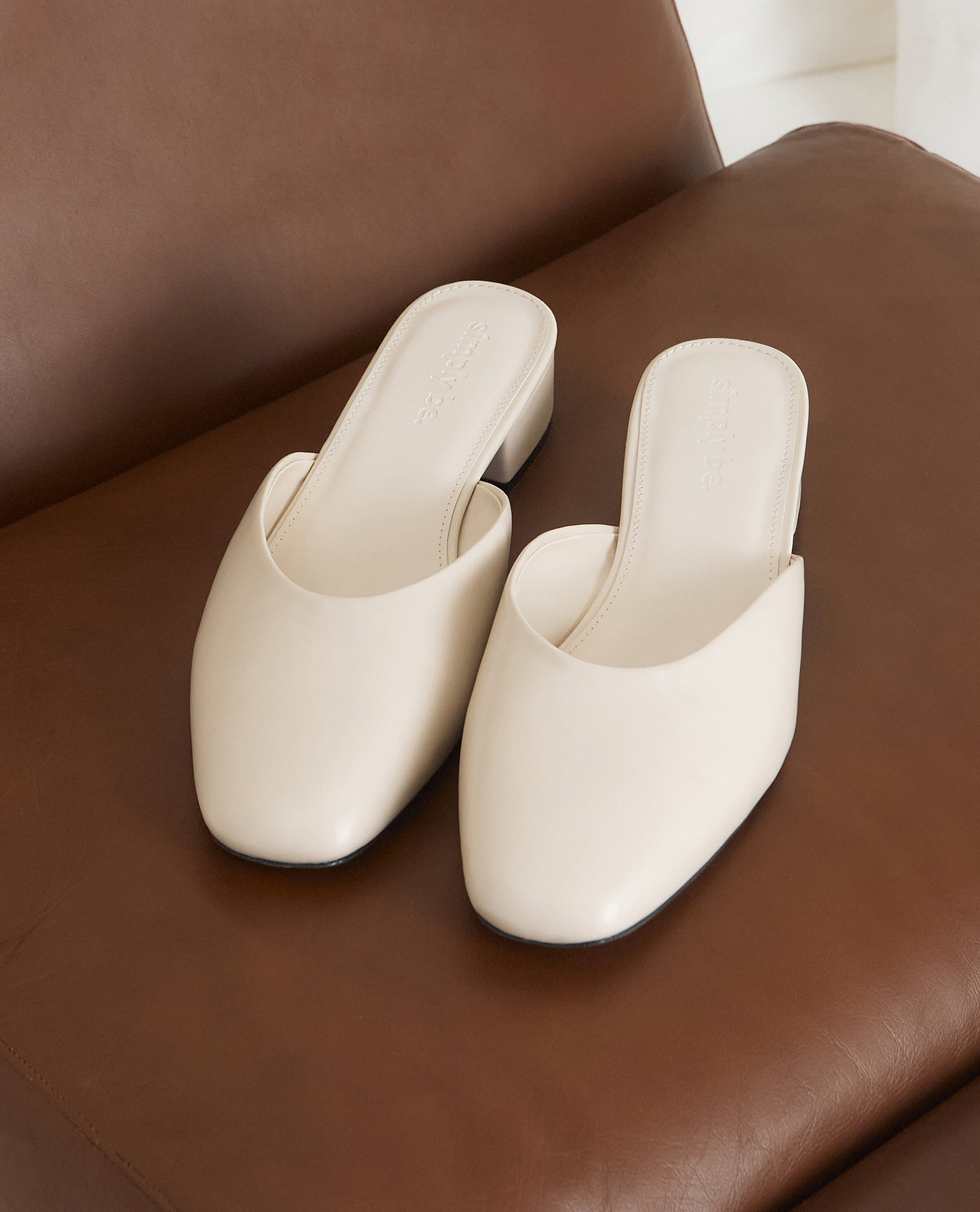 mule sandals in off-white