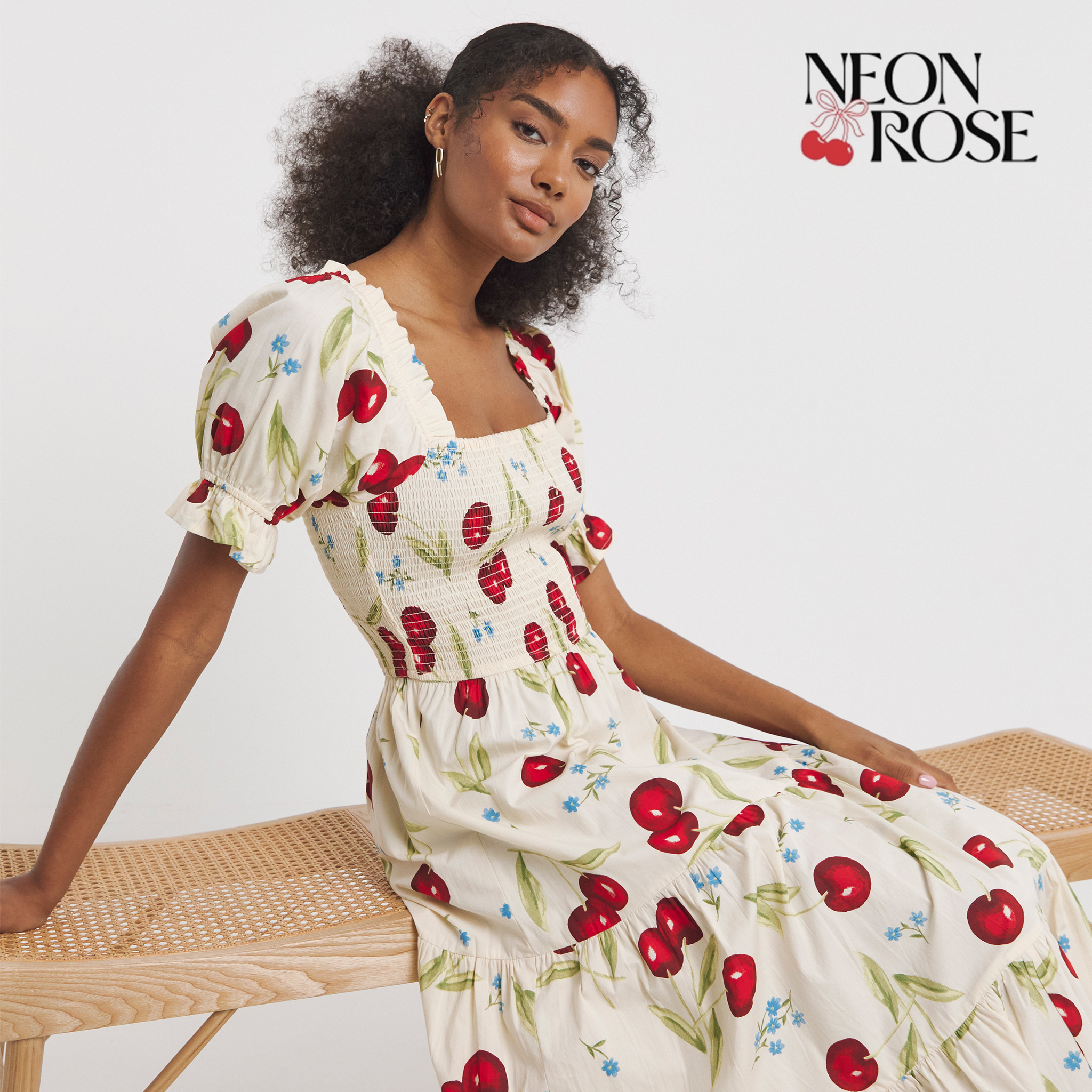 White dress with cherry print from Neon Rose