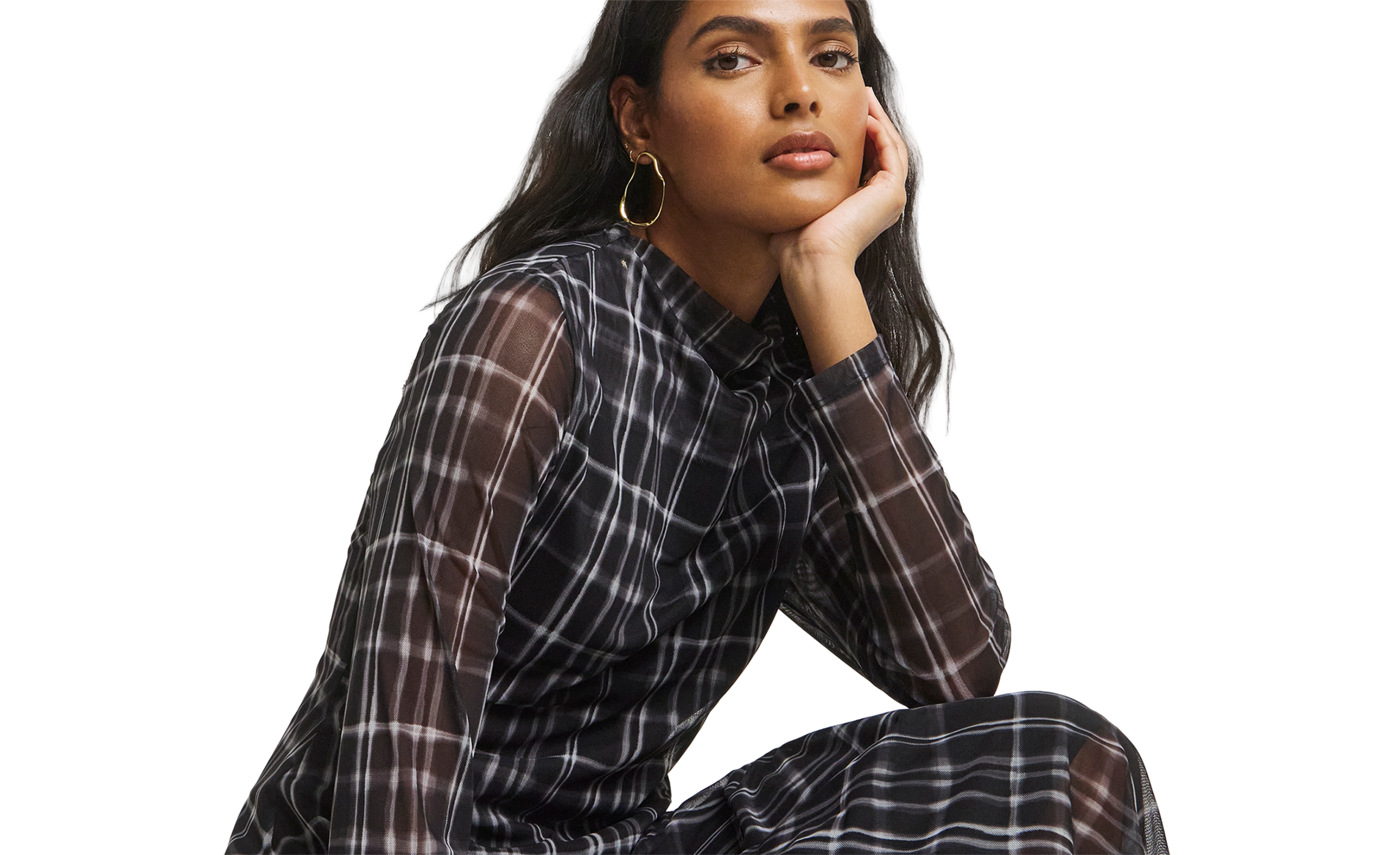 Model wears check print dress