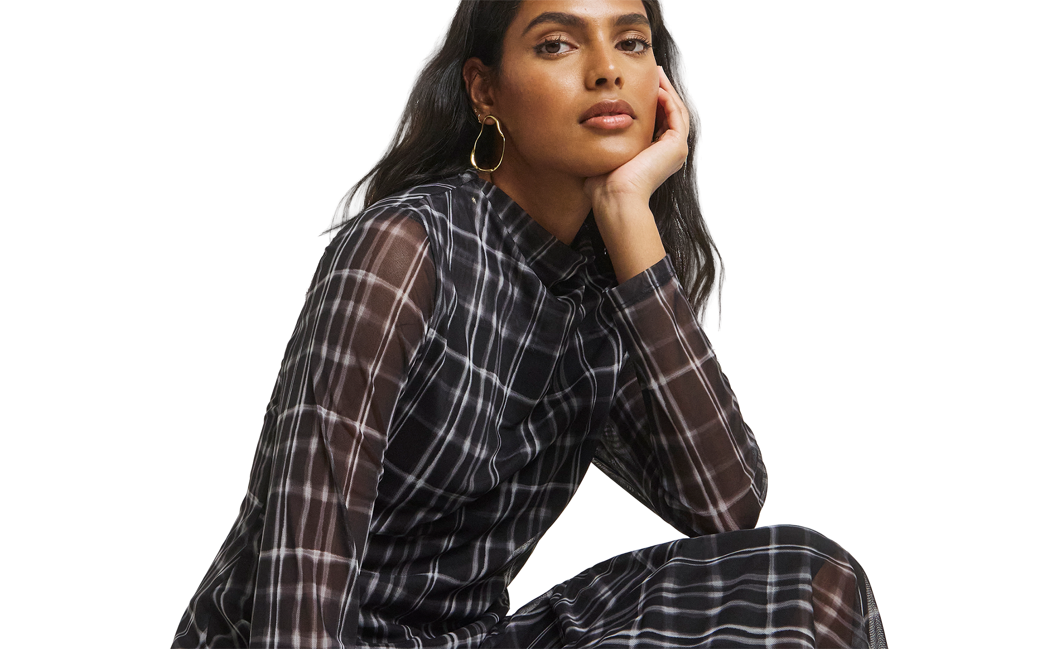 Model wears check print dress