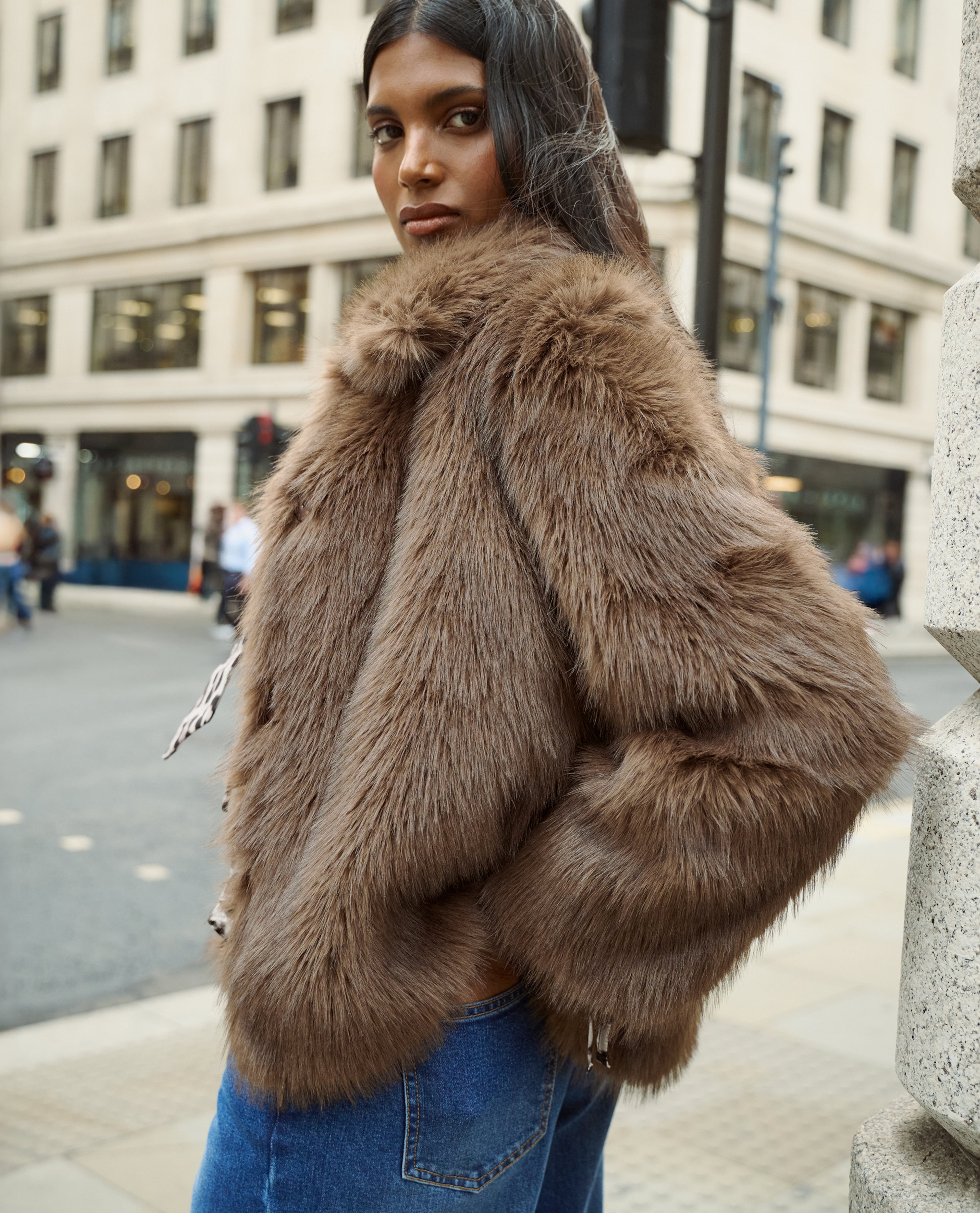 Model wears faux fur coat