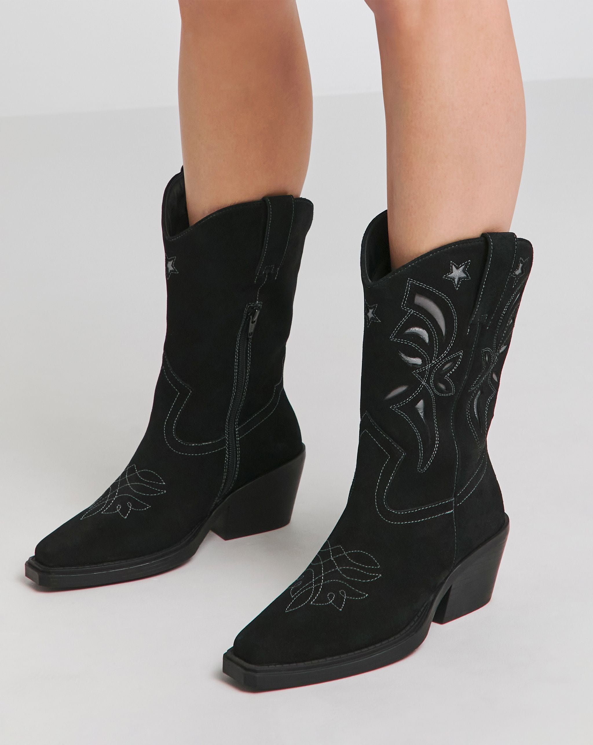 A pair of black cowboy boots