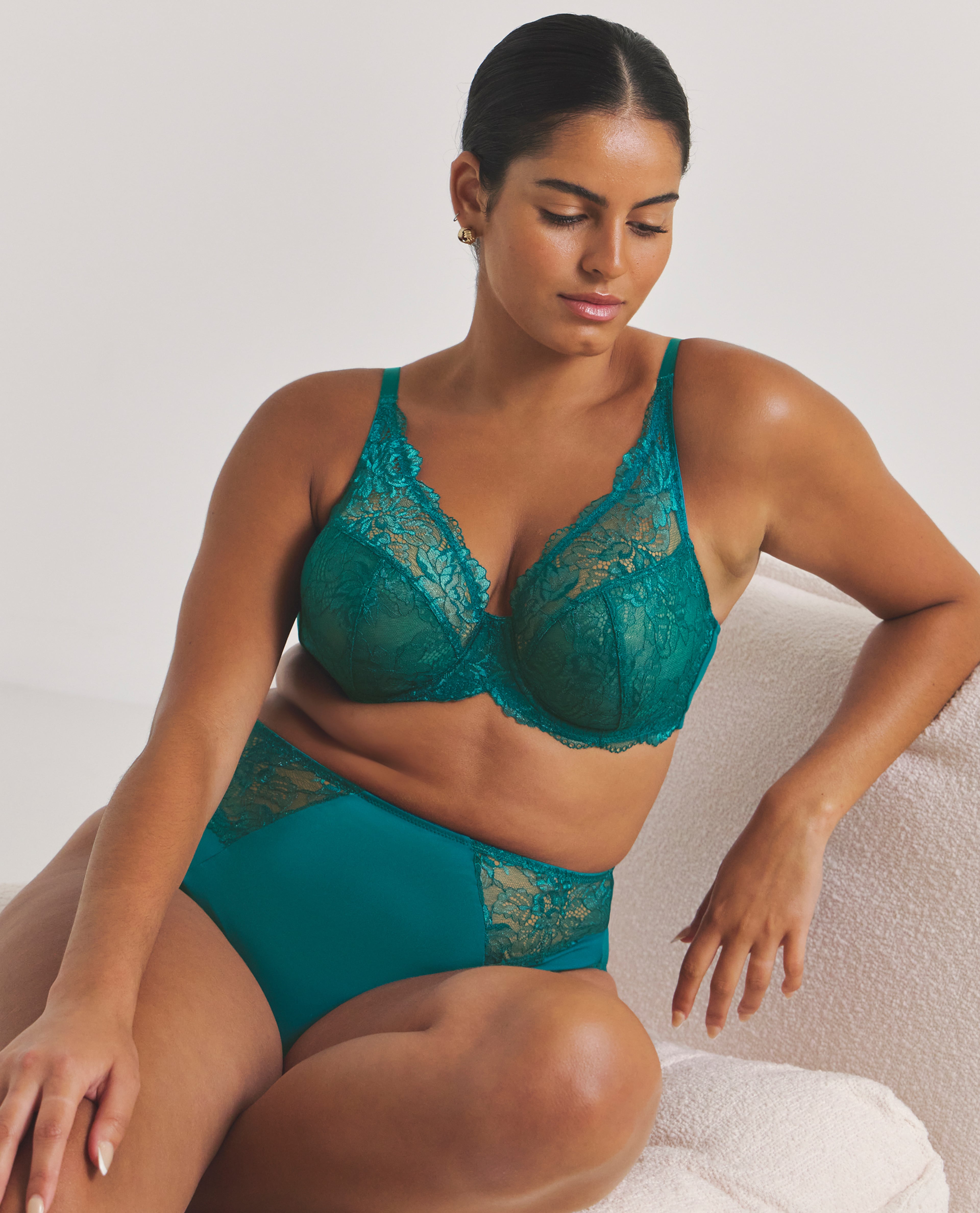 Model wears lingerie set in teal