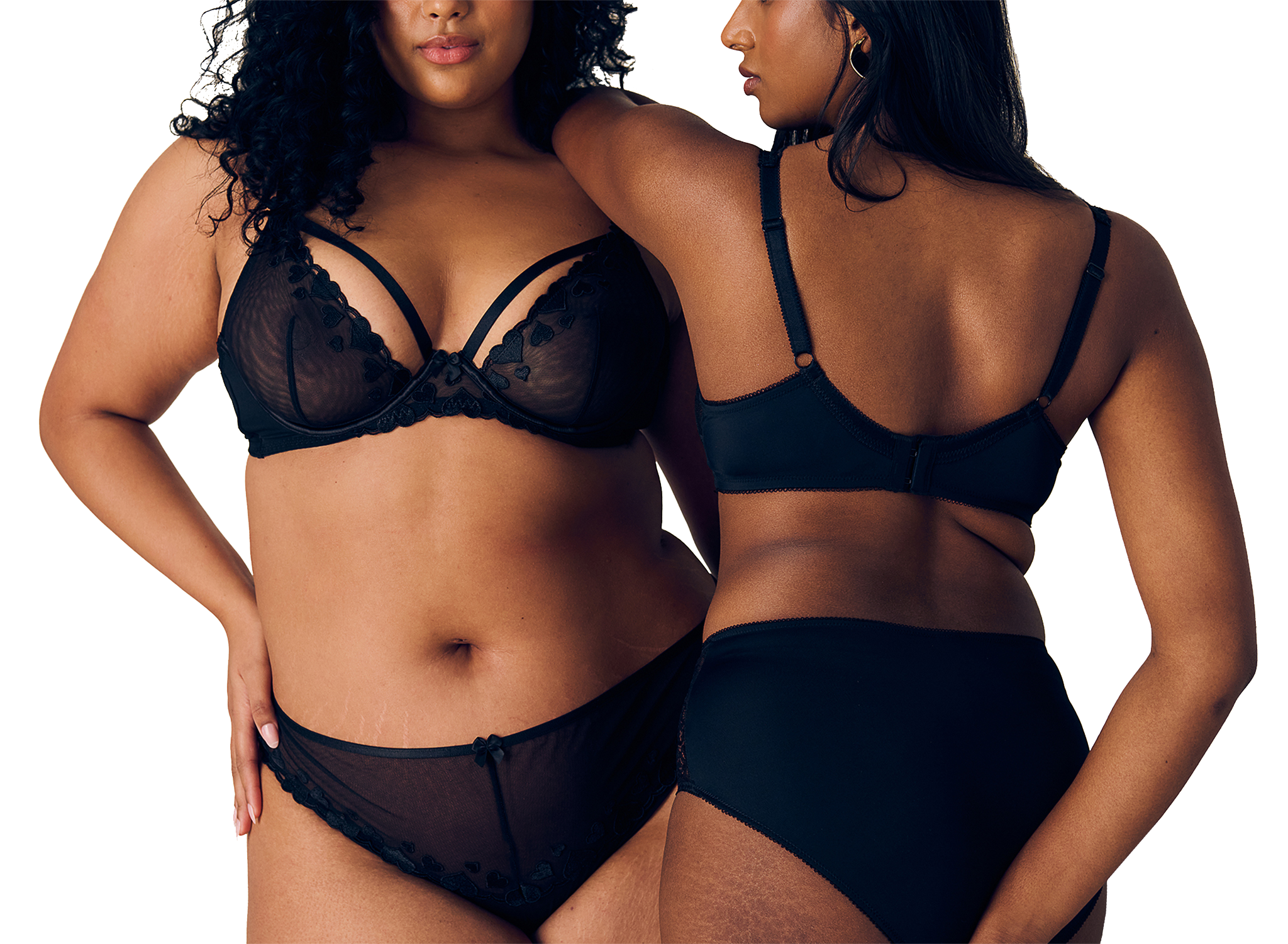 2 women wearing black lingerie