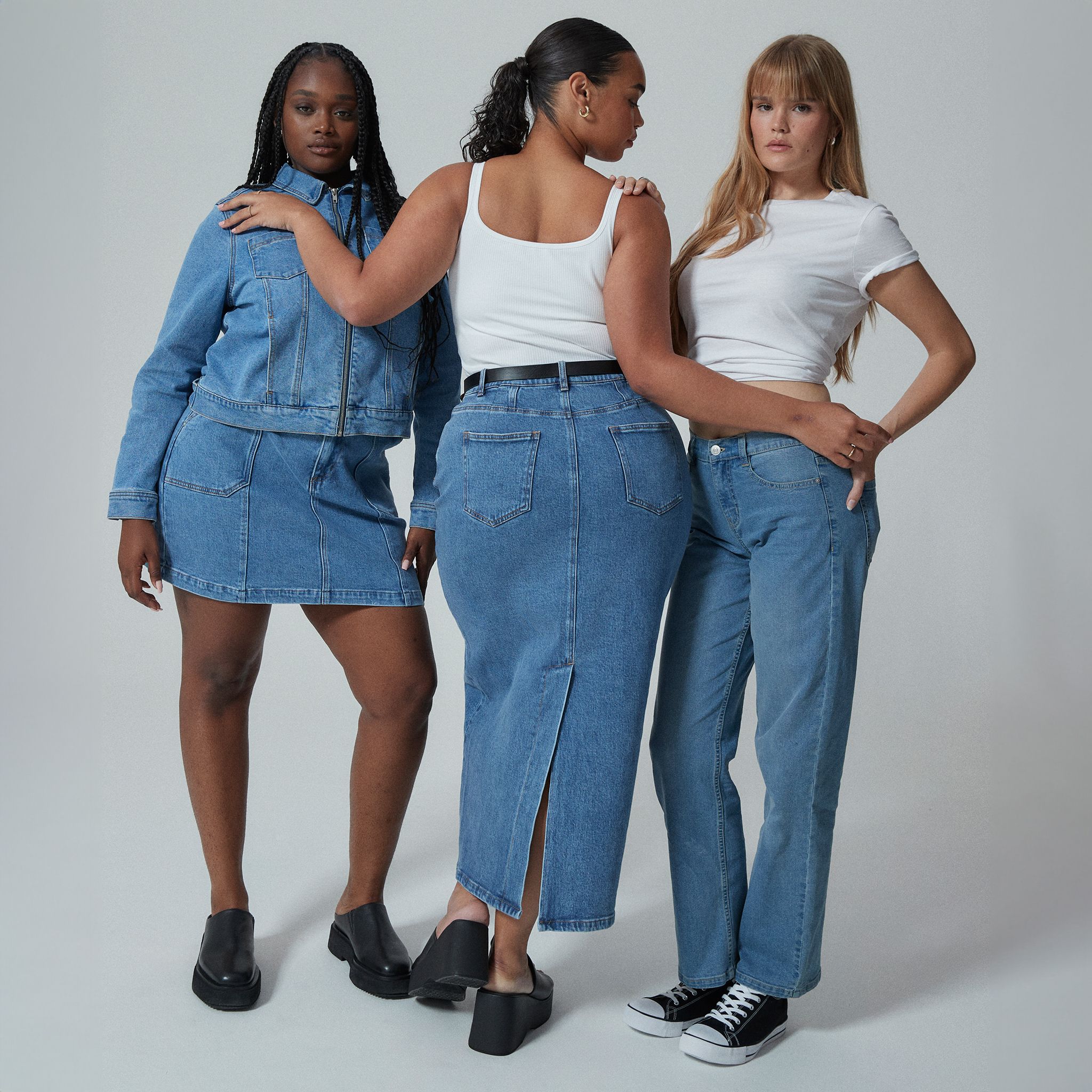 3 models wearing new season denim in mid blue