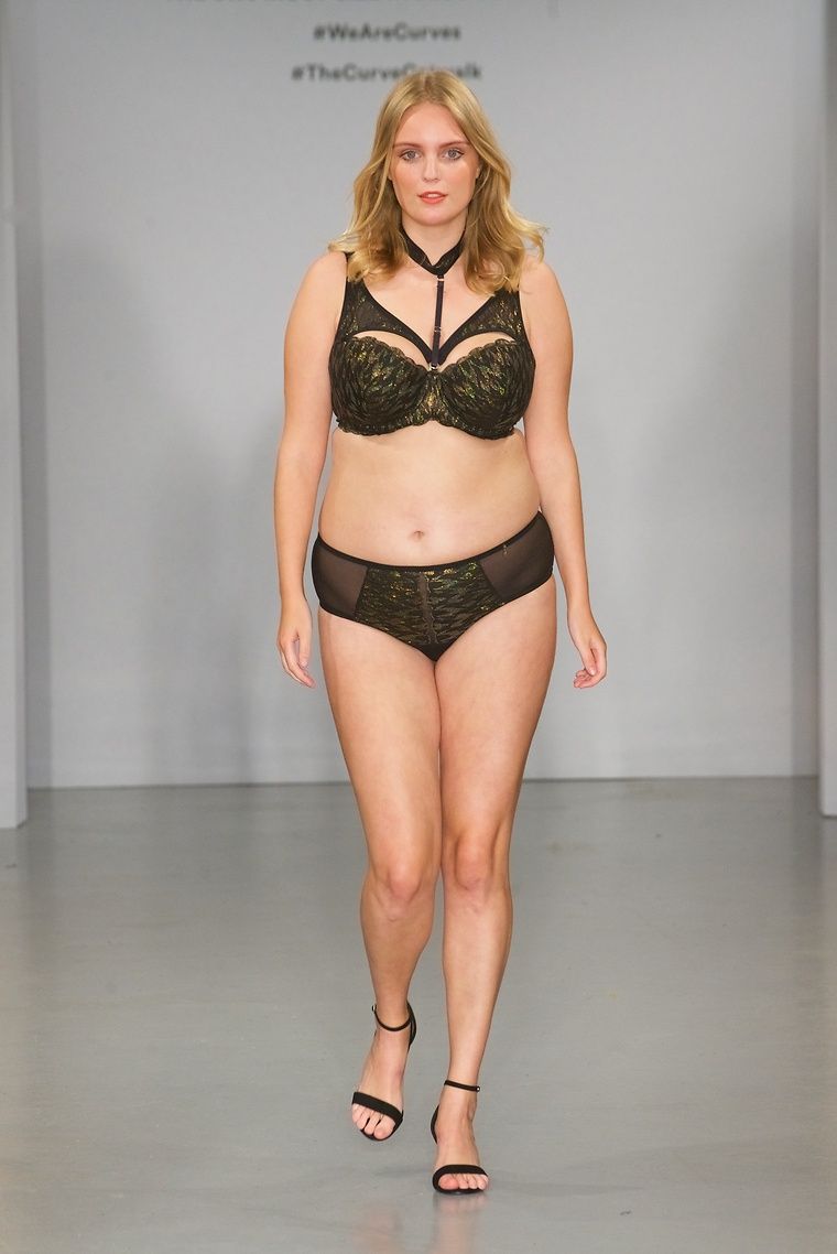 Model showcasing lingerie on the catwalk