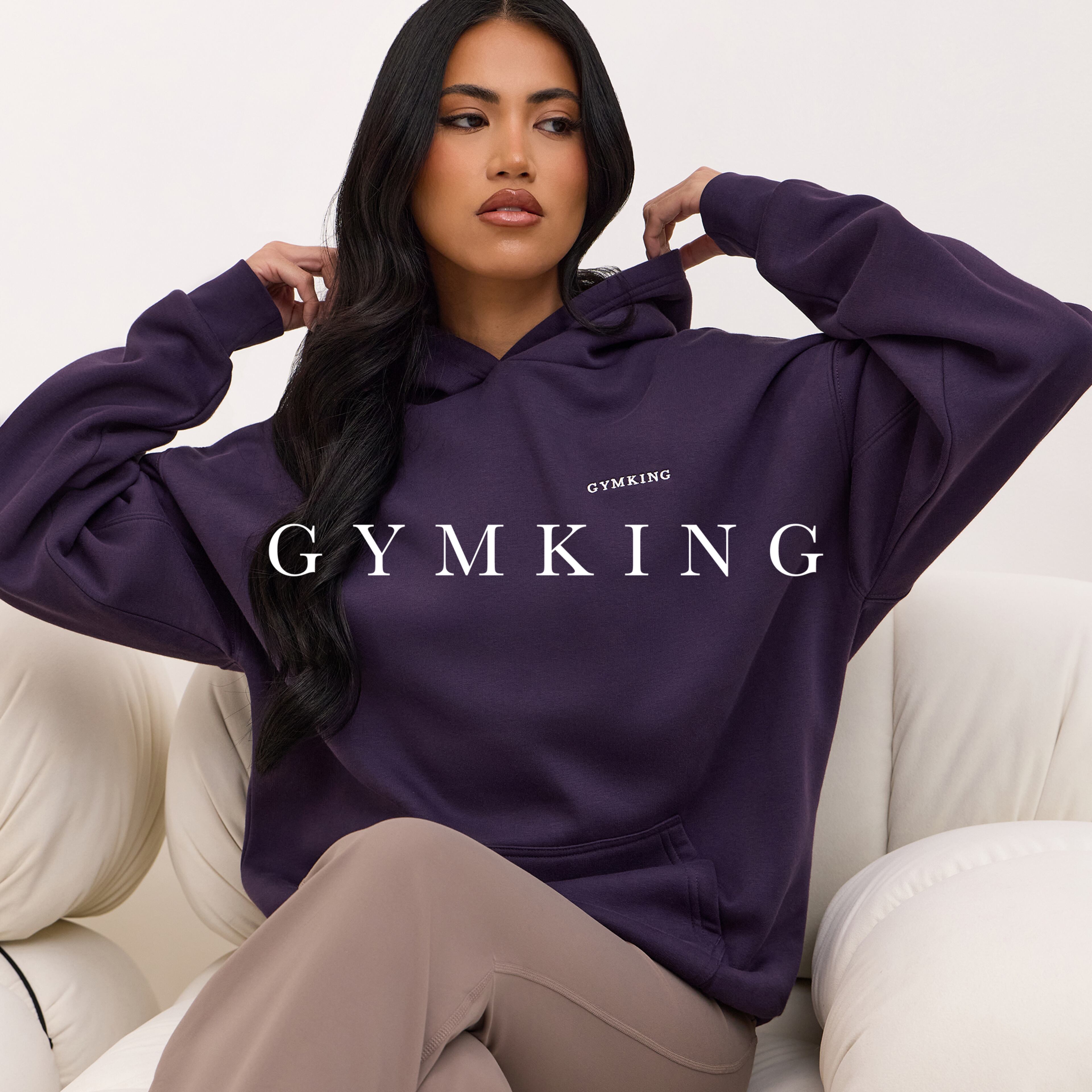 Model wears Gym King hoody in dark purple