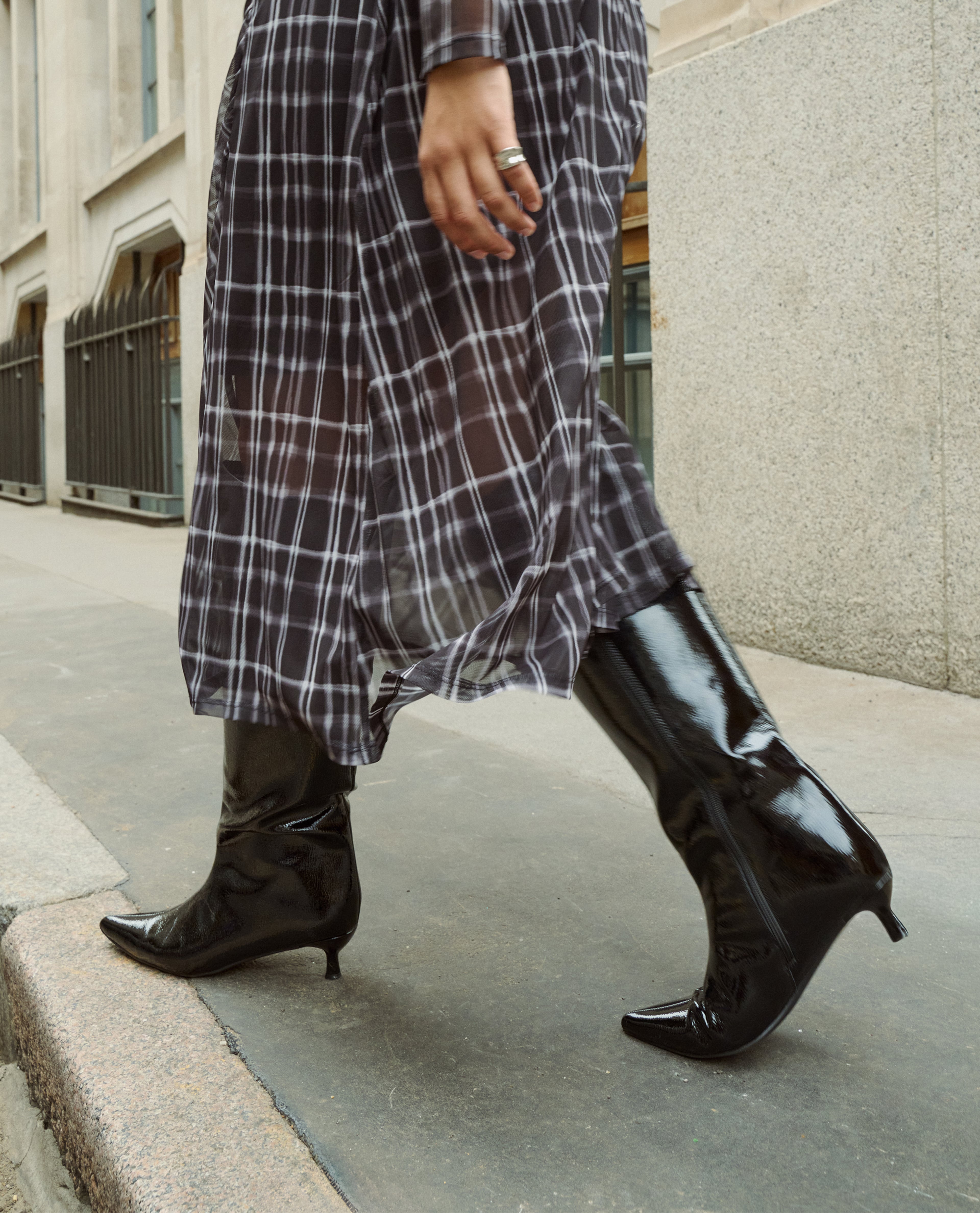 Model wears black patent boots