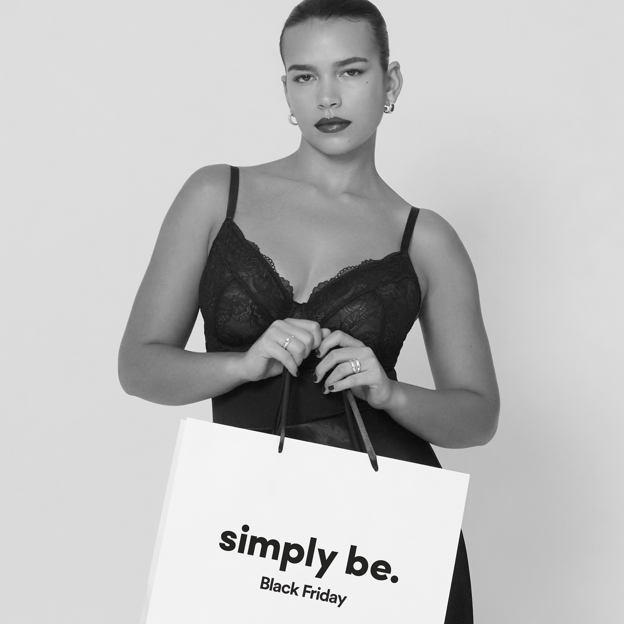 Model wearing a lingerie corset top with a maxi skirt.