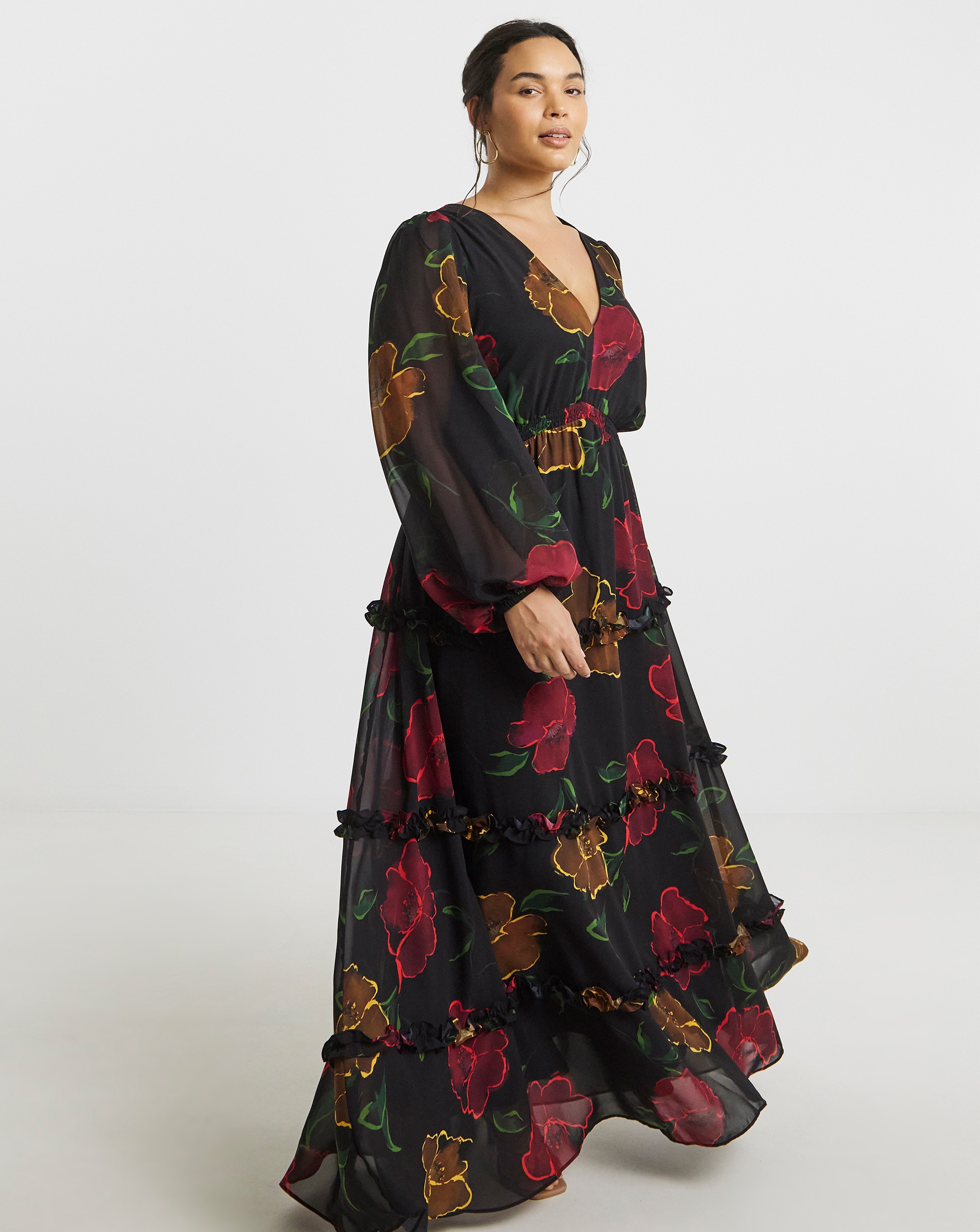 Model wears floral maxi dress in black and red